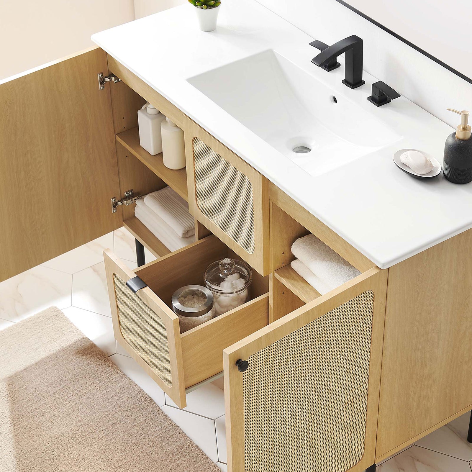 Adjustable shelves and a center drawer keep bathroom essentials organized. || EEI-6699-OAK-WHI || front_angle_open_room