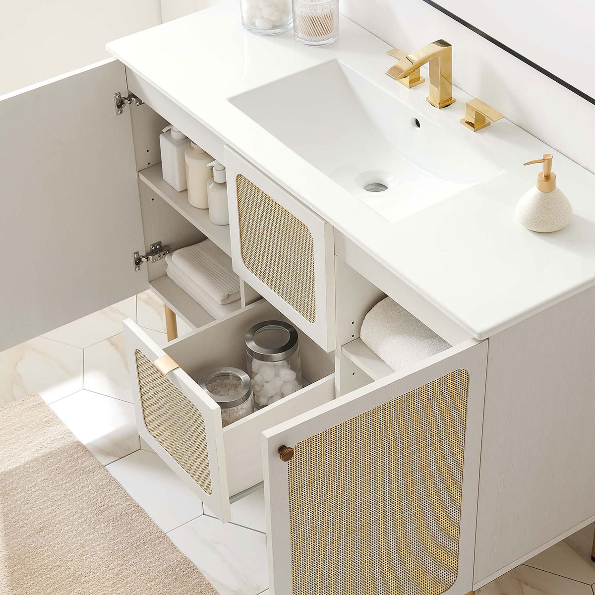 Ample storage with adjustable shelves and a deep drawer keeps bathroom items organized || EEI-6699-WHI-WHI || front_angle_open_room