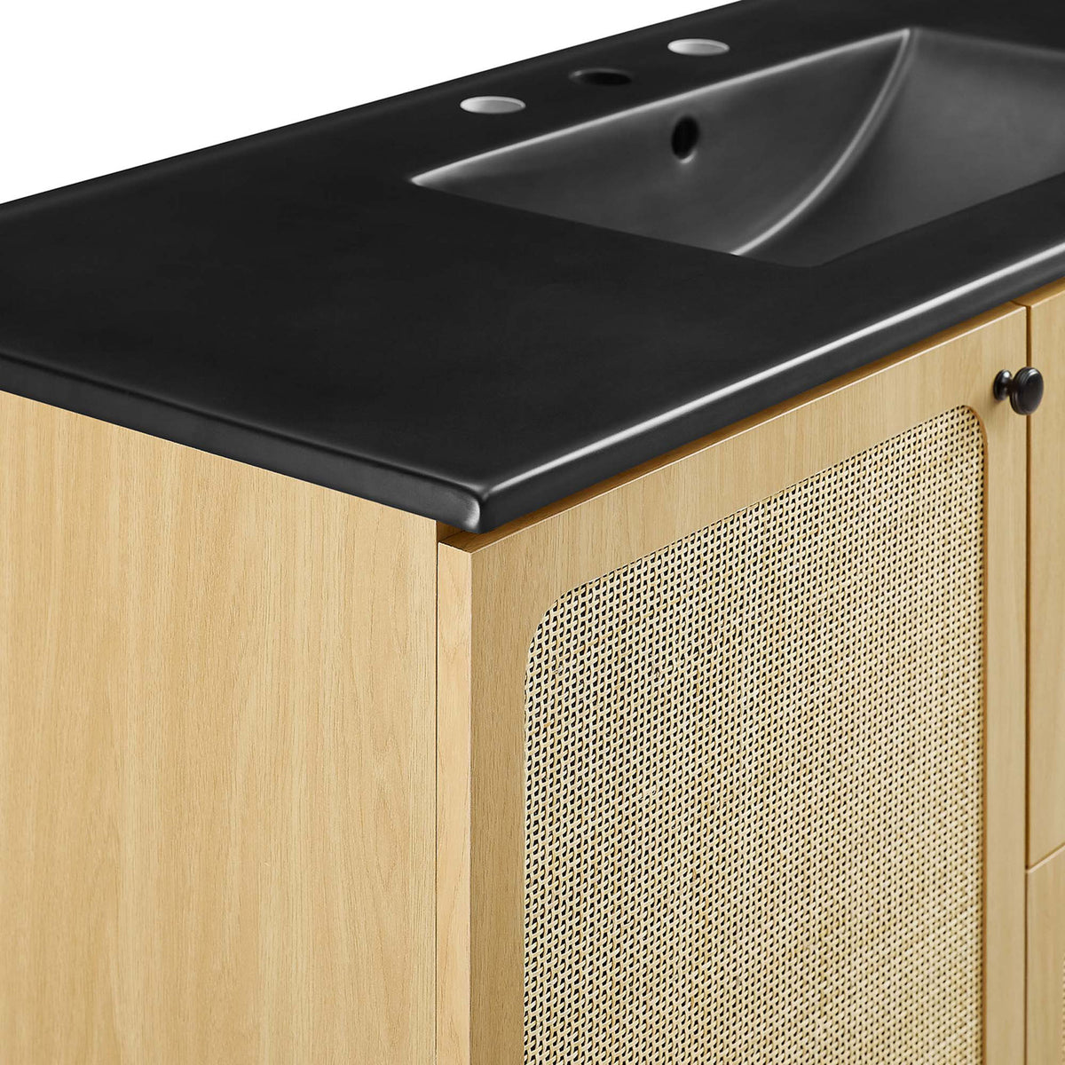 Rounded countertop edge and cane door texture bring tactile contrast to the oak finish || EEI-6700-OAK-BLK || detail_studio