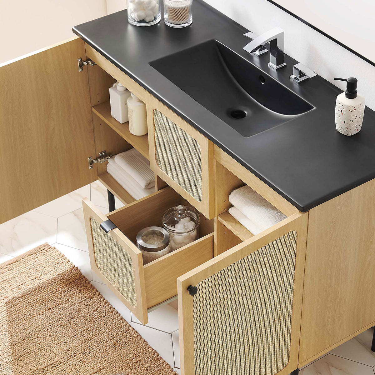 Ample storage is revealed behind the doors and drawer while the basin keeps counters clutter-free || EEI-6700-OAK-BLK || front_angle_open_room