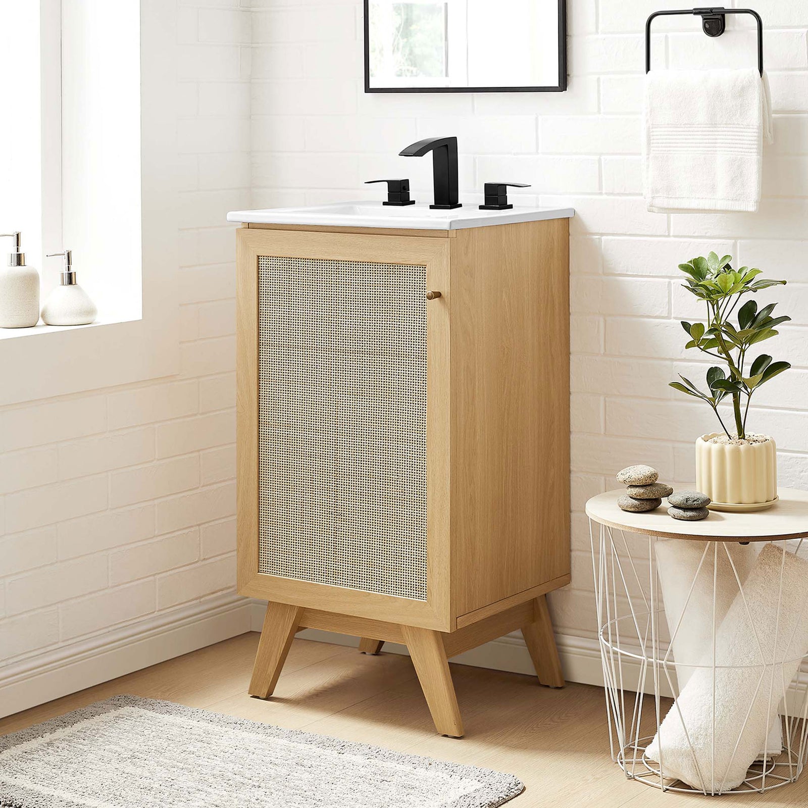 Warm oak vanity and white sink add natural texture to a bright bathroom || EEI-6711-OAK-WHI || front_angle_room