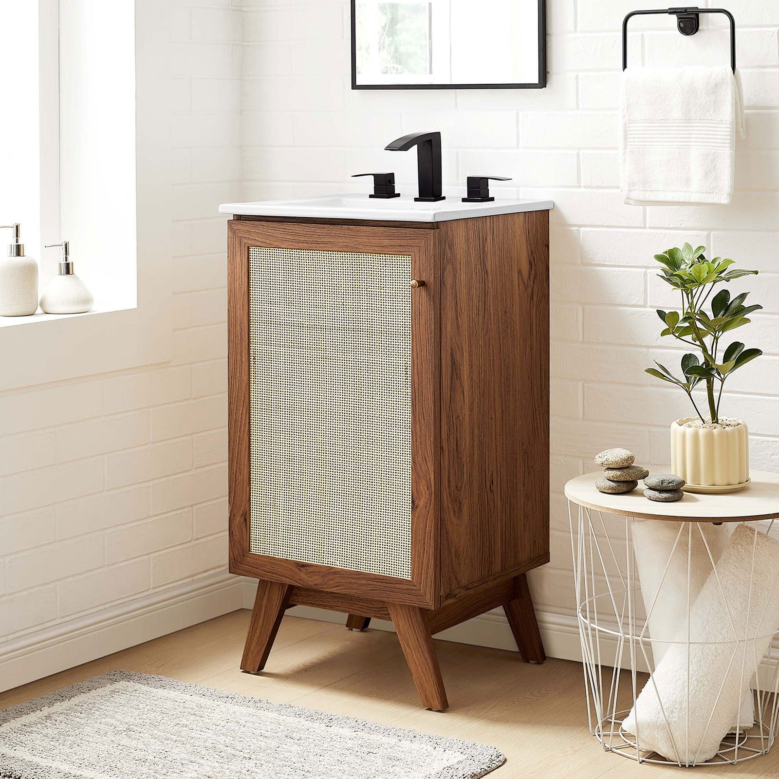 Warm walnut vanity with rattan door and white sink elevates a bright, spa-like bathroom. || EEI-6711-WAL-WHI || front_angle_room
