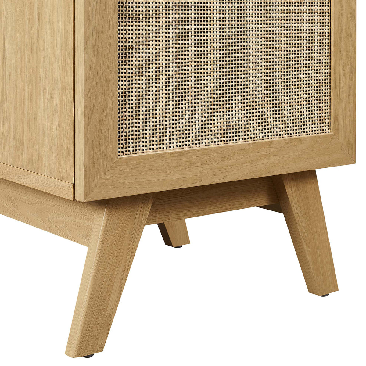 Tapered legs and framed rattan panel highlight the mid-century base || EEI-6712-OAK-BLK || leg_studio