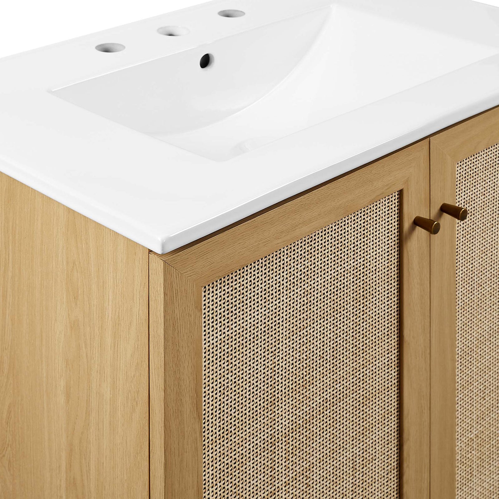 Brushed gold knobs and woven cane panels add refined, organic texture. || EEI-6715-OAK-WHI || detail_studio