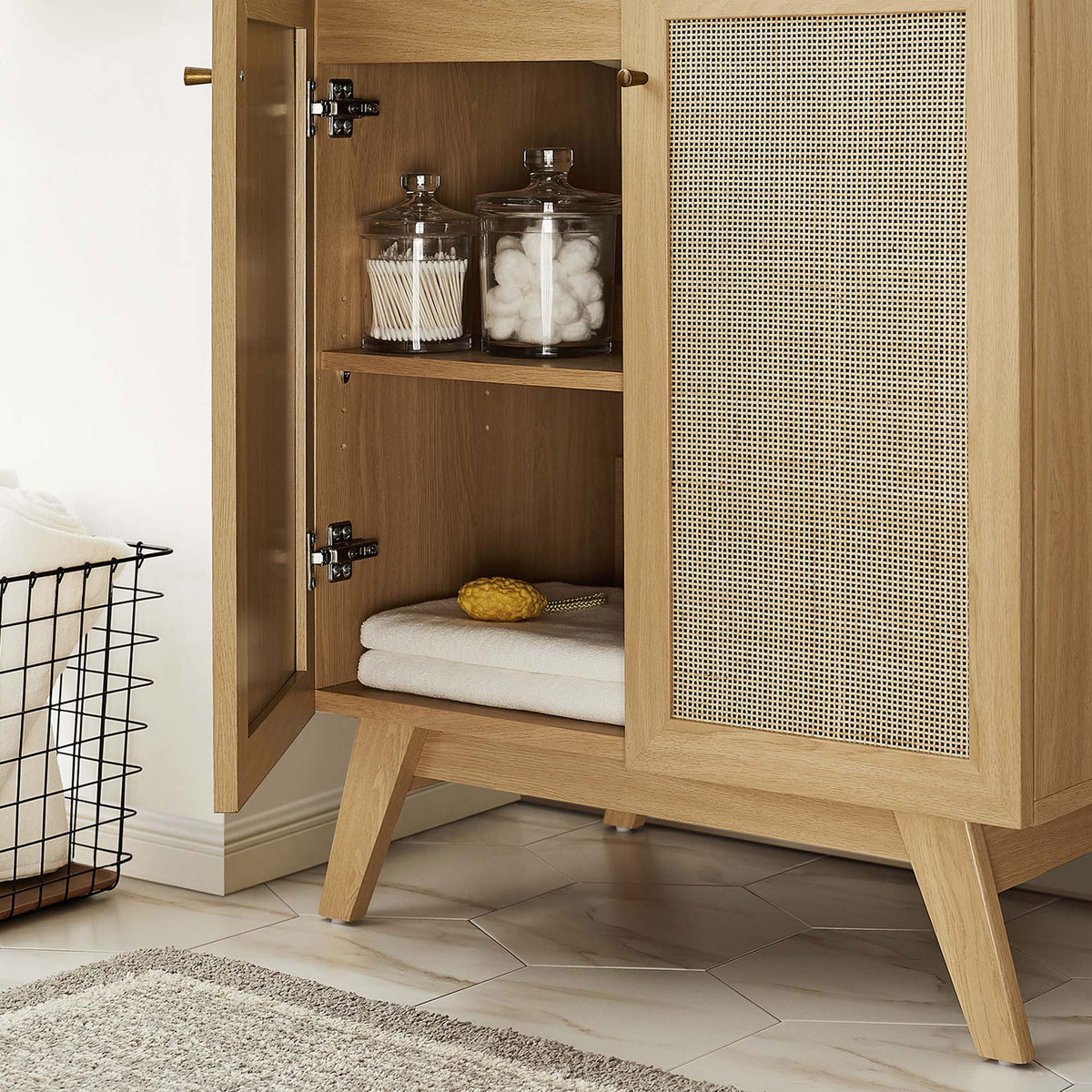 Adjustable shelf keeps towels and toiletries organized behind soft-close doors. || EEI-6715-OAK-WHI || storage_open_room