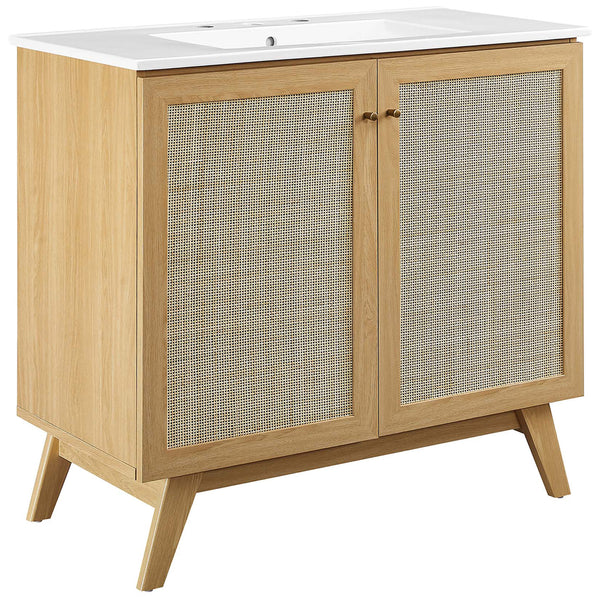 Wider vanity pairs cane doors with a white basin for a breezy, modern look. || EEI-6717-OAK-WHI || front_angle_studio