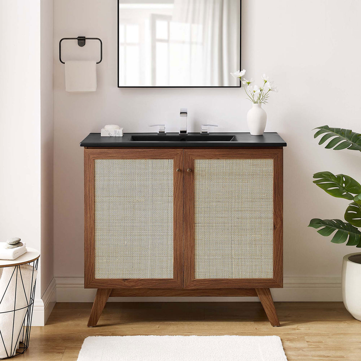 Walnut cabinet and black sink create warm contrast that elevates contemporary bathrooms. || EEI-6718-WAL-BLK || front_room