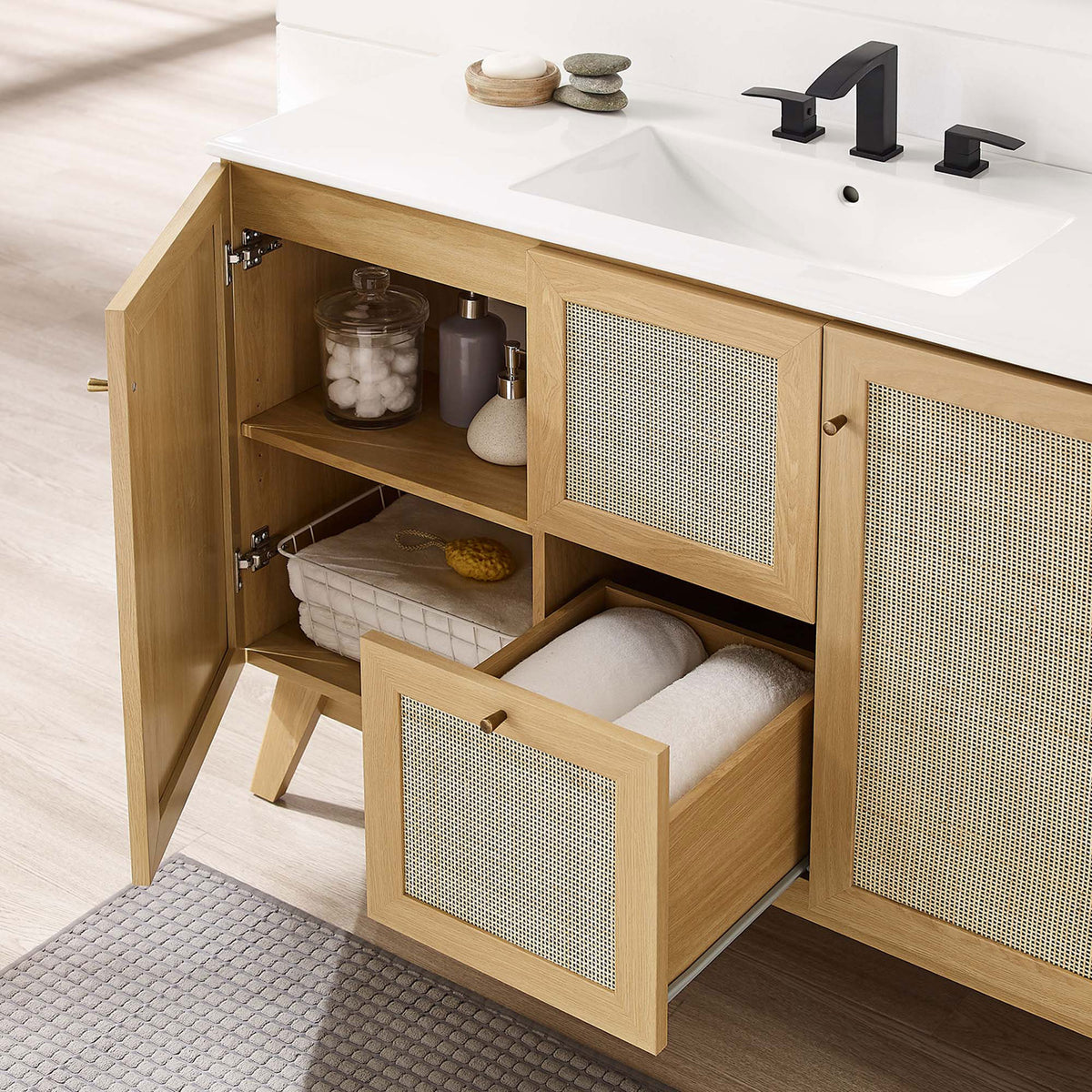Adjustable-shelf cabinet and center drawer keep towels and toiletries neatly organized || EEI-6719-OAK-WHI || storage_open_room