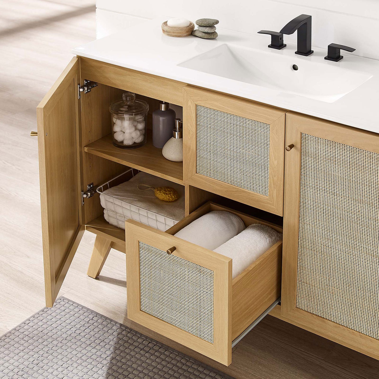 Adjustable-shelf cabinet and center drawer keep towels and toiletries neatly organized || EEI-6719-OAK-WHI || storage_open_room