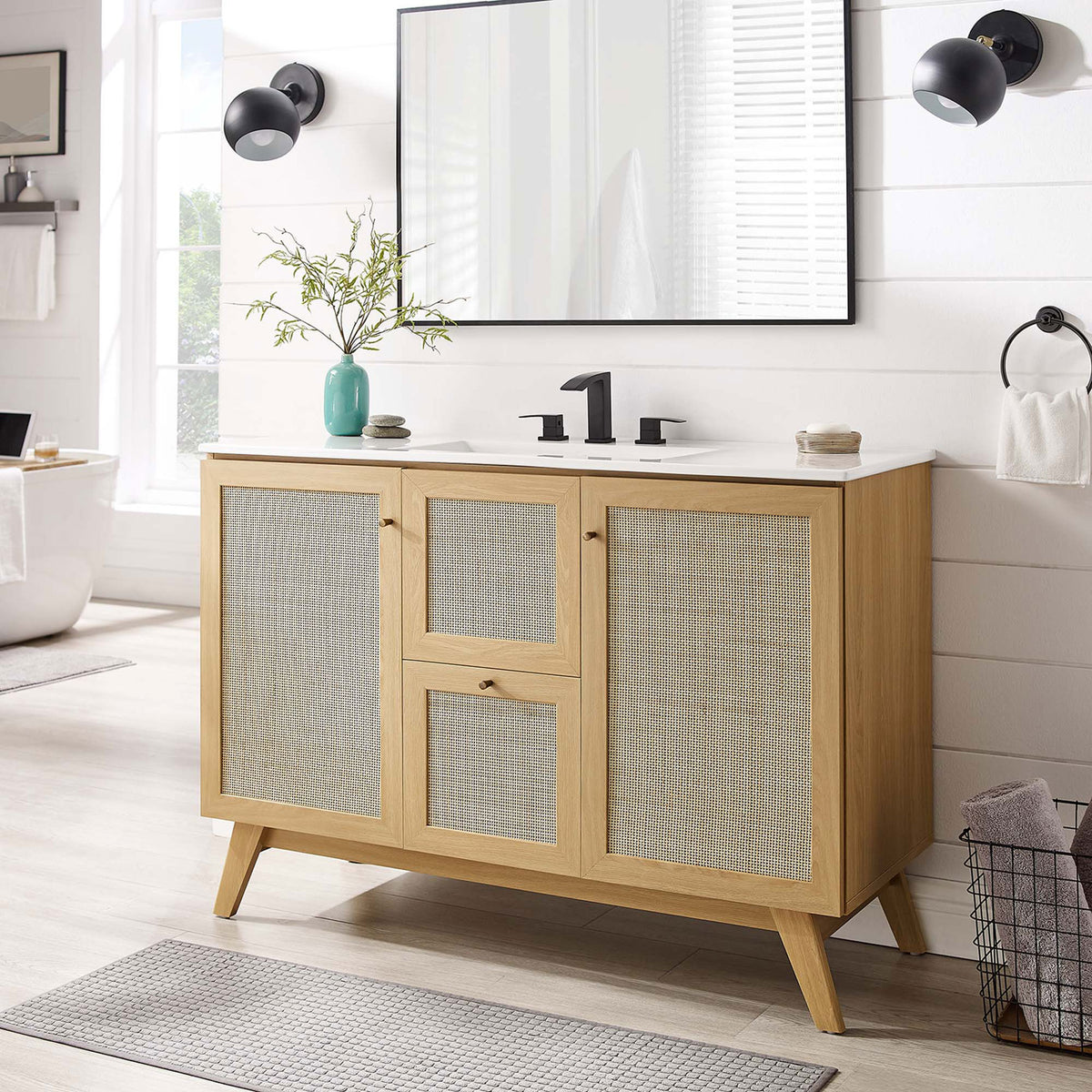 Organic oak vanity with rattan fronts and a sleek white basin warms a modern bath || EEI-6719-OAK-WHI || front_room