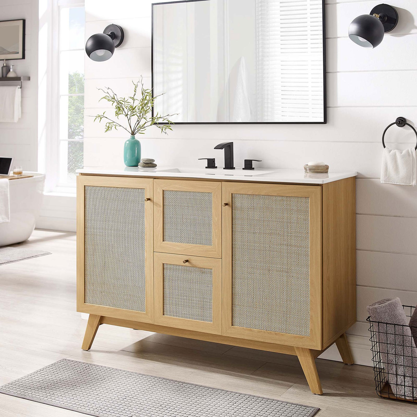 Organic oak vanity with rattan fronts and a sleek white basin warms a modern bath || EEI-6719-OAK-WHI || front_room