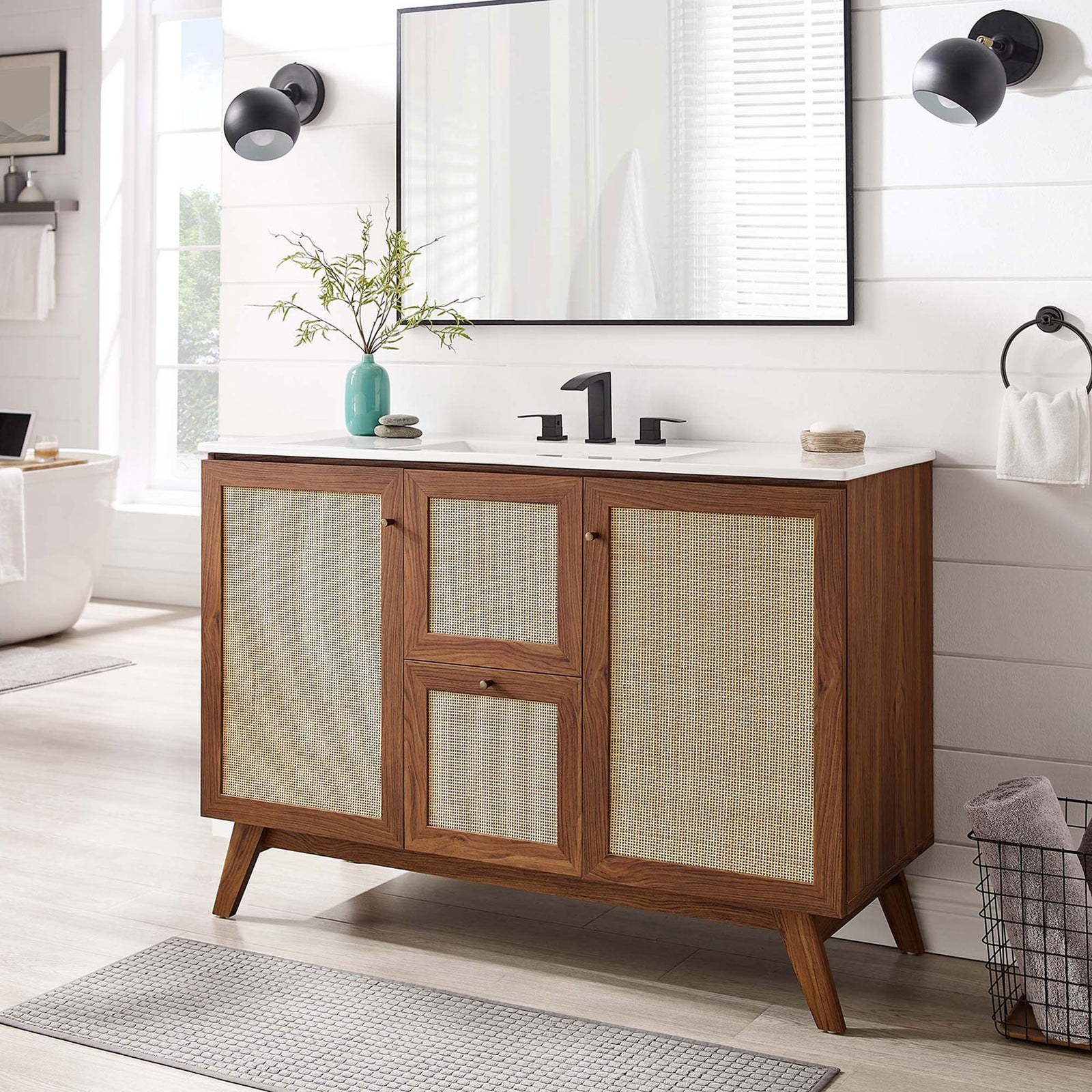 Lifestyle view showcasing warm walnut finish, rattan panels, and an integrated white sink || EEI-6719-WAL-WHI || front_room