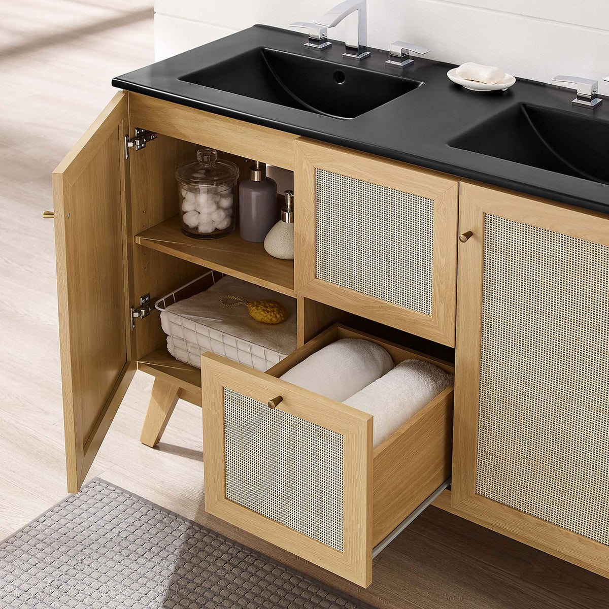 Open doors and drawer showcase abundant storage, bringing organic warmth to the bath || EEI-6722-OAK-BLK || front_angle_open_room