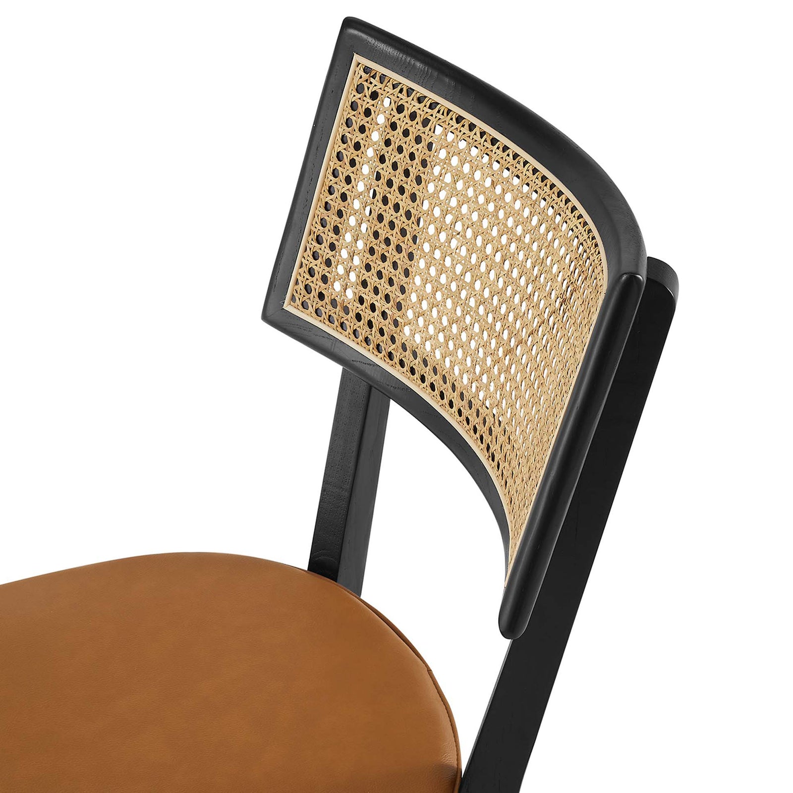 Woven rattan backrest and neatly tailored tan vegan leather seat on a black wood dining chair || EEI-6732-BLK-TAN || detail_studio