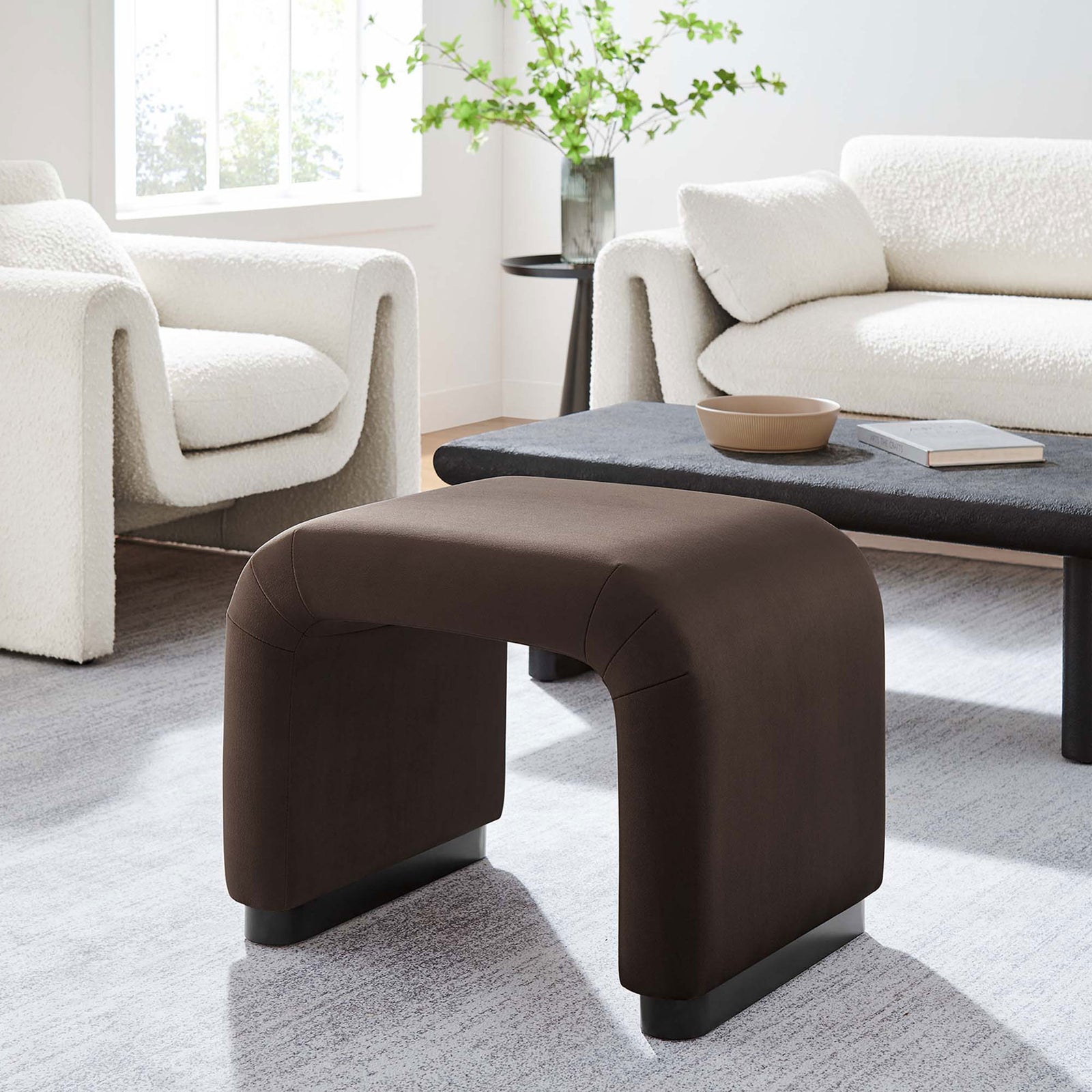 Versatile waterfall stool adds a sculptural touch and soft comfort to modern living rooms || EEI-6733-BLK-CHB || front_angle_room