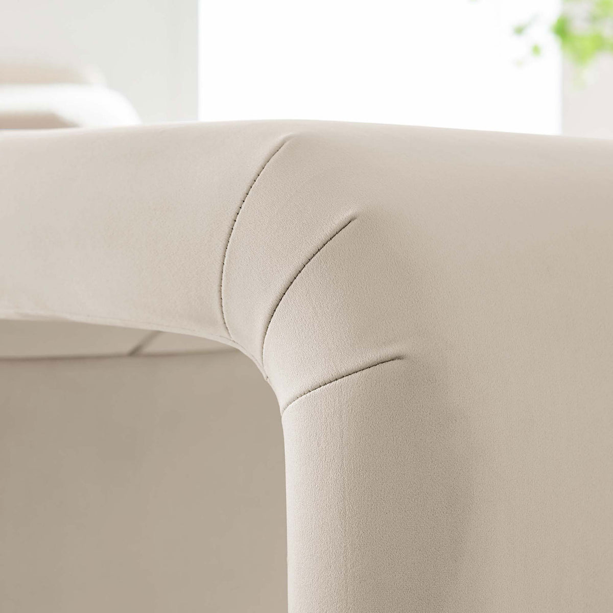 Soft velvet upholstery and subtle channel seams create a smooth, inviting touch || EEI-6733-BRA-ALM || detail_room