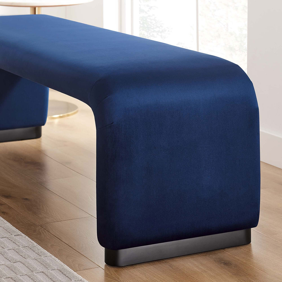 Rich midnight blue velvet adds a modern accent against warm wood floors and natural light || EEI-6734-BLK-MID || detail_room