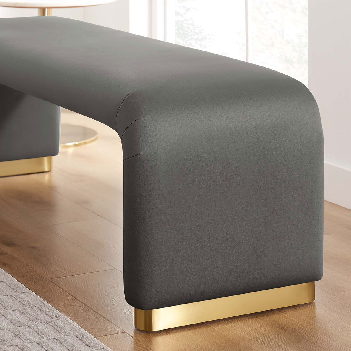 Close-up of the gray velvet upholstery and brass base bringing luxe texture to a modern living space || EEI-6734-BRA-STG || detail_room