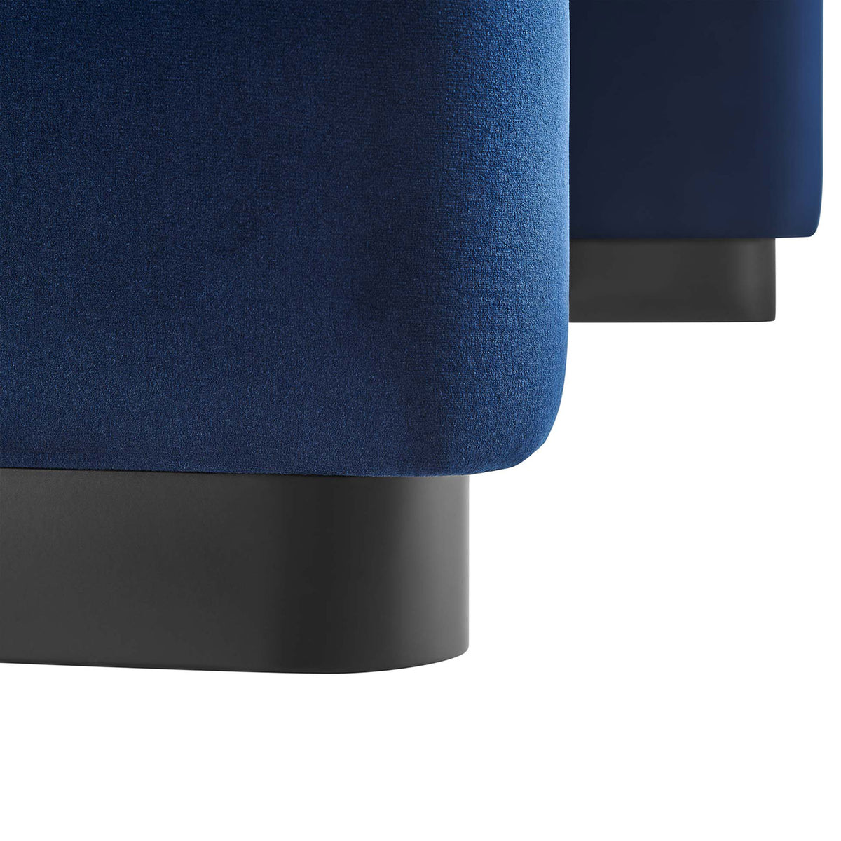 Close-up of the ottoman base, contrasting the midnight blue velvet with the black metal plinth || EEI-6735-BLK-MID || leg_studio