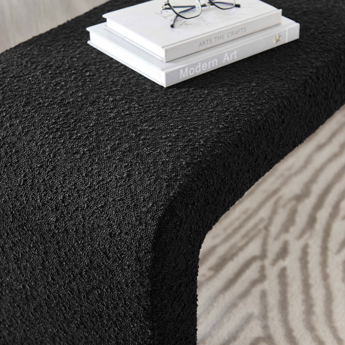 Textured black boucle surface with smooth waterfall curve creates a refined, tactile accent || EEI-6736-BLK || detail_room