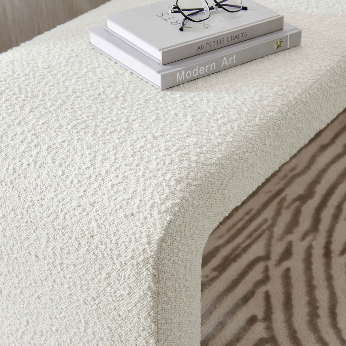 Ivory boucle bench styled with books, highlighting cozy texture in a serene bedroom || EEI-6736-IVO || detail_room