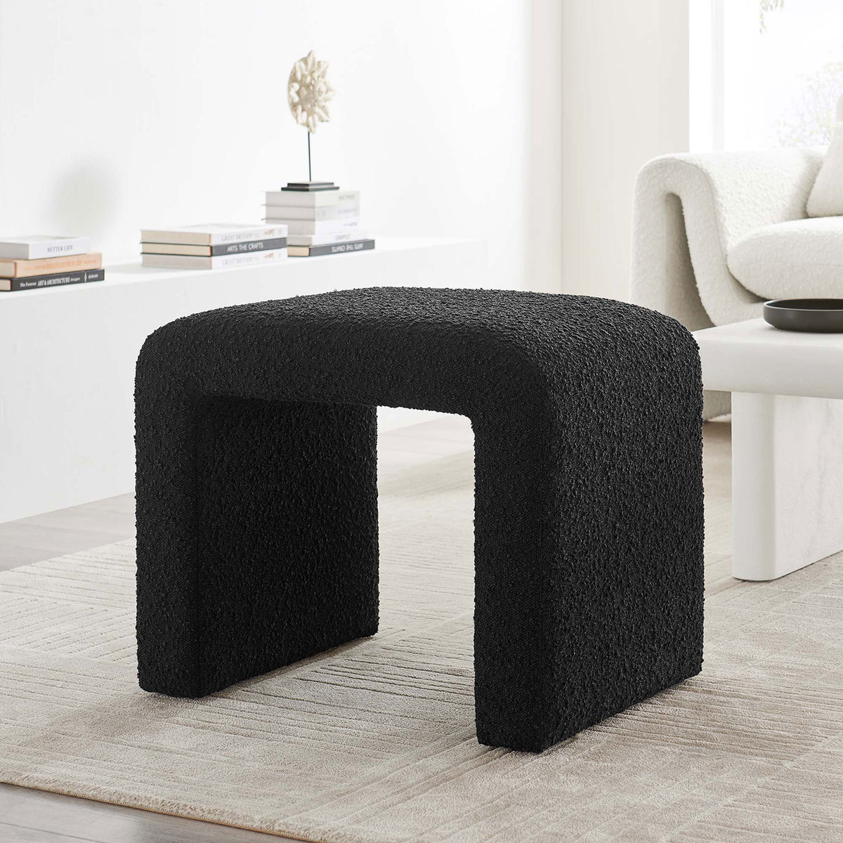 Versatile black boucle waterfall stool anchors the space as a chic seat or impromptu side table || EEI-6737-BLK || front_room