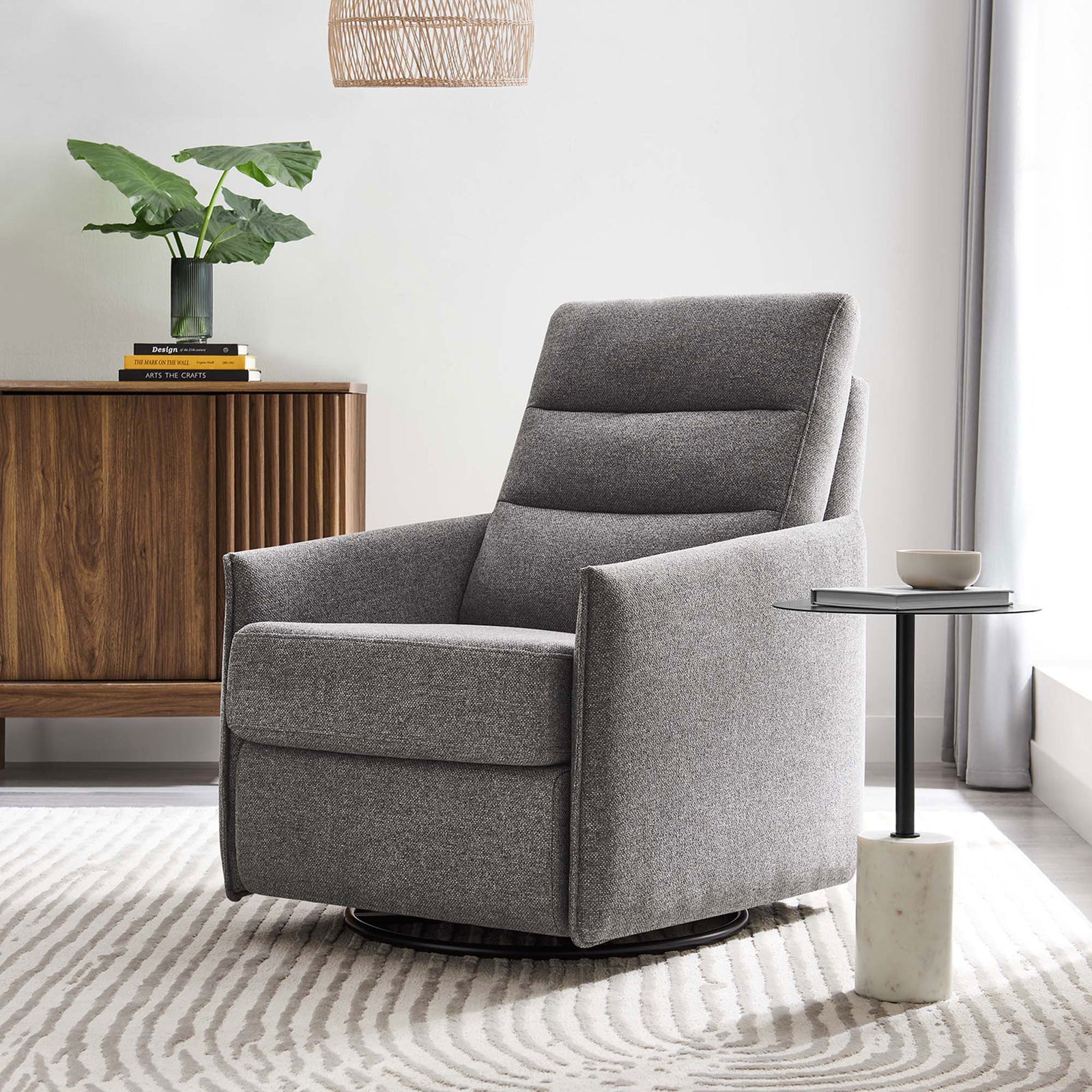 Inviting light gray lounge chair anchors the space with modern comfort and smooth swivel-glide motion || EEI-6738-GRY || front_angle_room