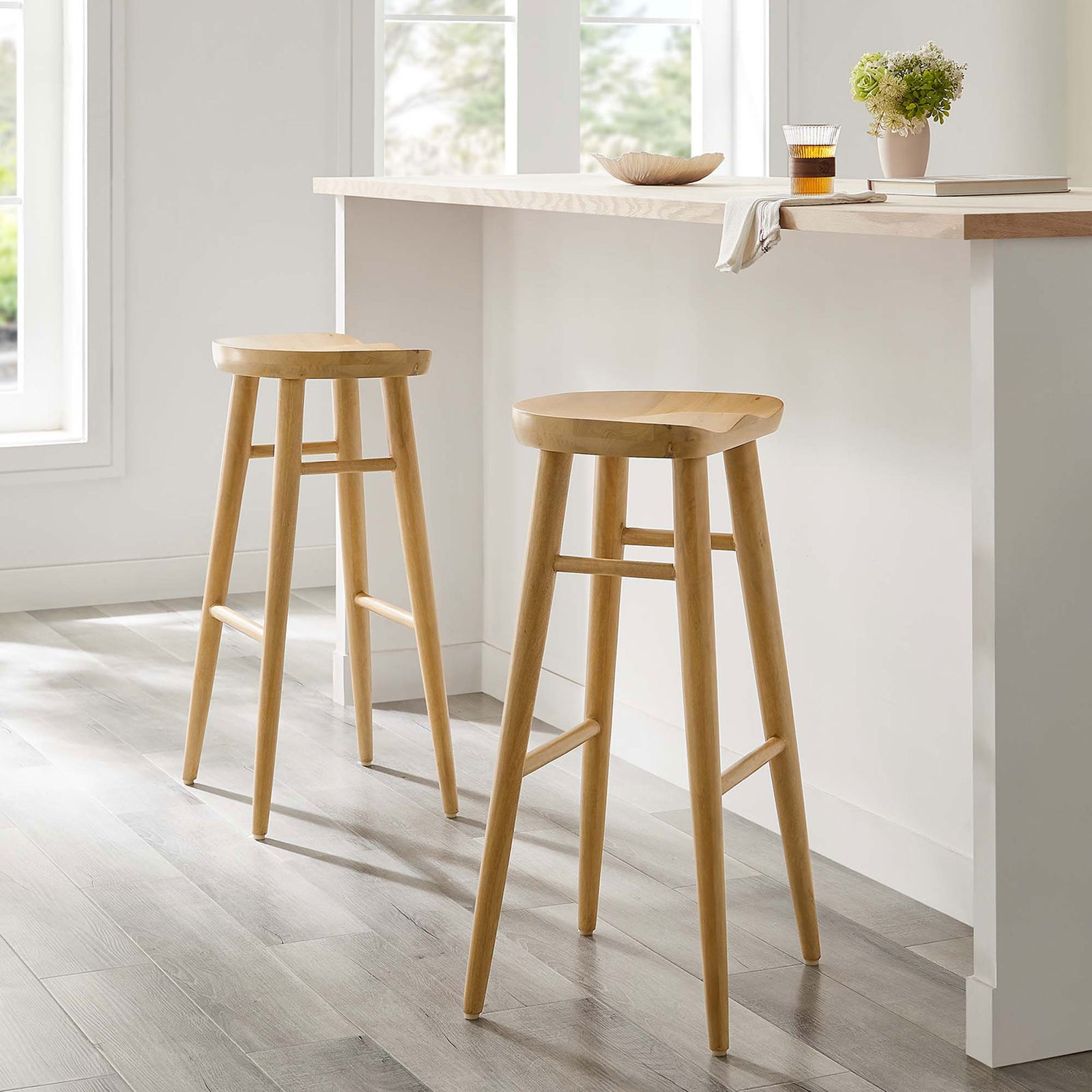 Pair of bar stools elevates a bright kitchen with warm natural wood texture || EEI-6740-OAK || front_angle_multi_room