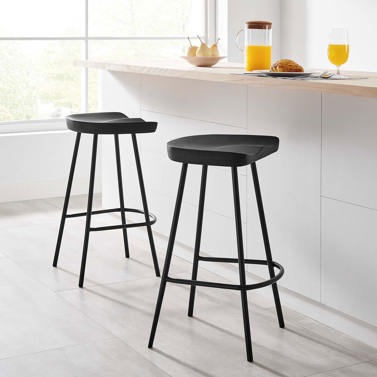 Two black counter stools add sleek, modern style to a bright kitchen island || EEI-6741-BLK || front_angle_multi_room