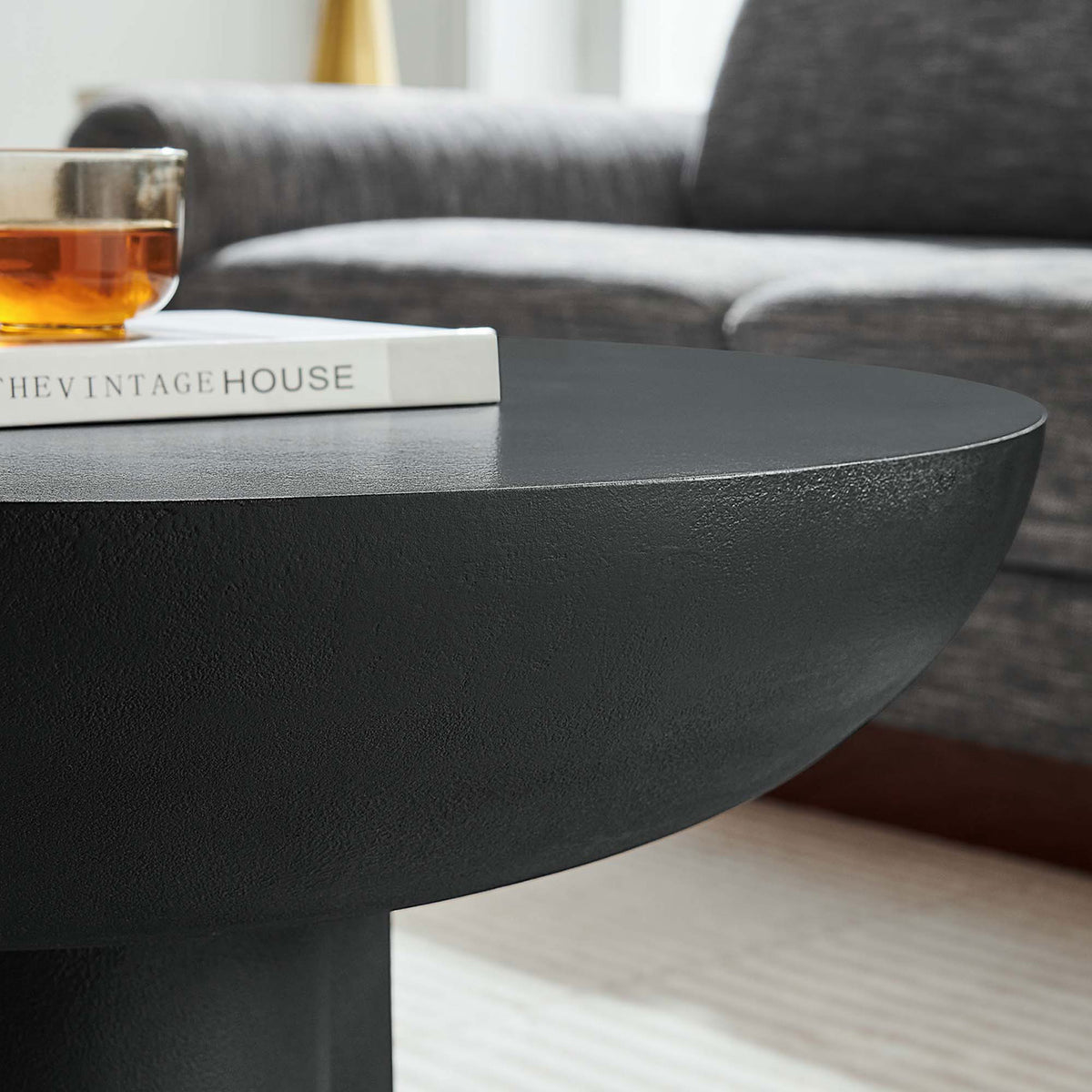 Sleek round top showcases refined texture that complements contemporary decor || EEI-6760-BLK || detail_room