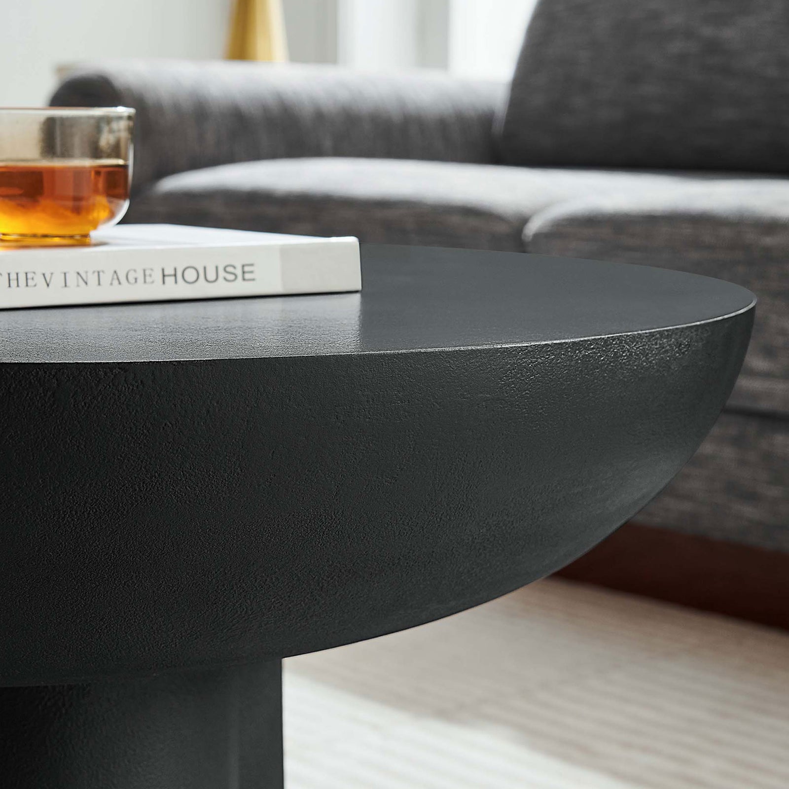 Sleek round top showcases refined texture that complements contemporary decor || EEI-6760-BLK || detail_room