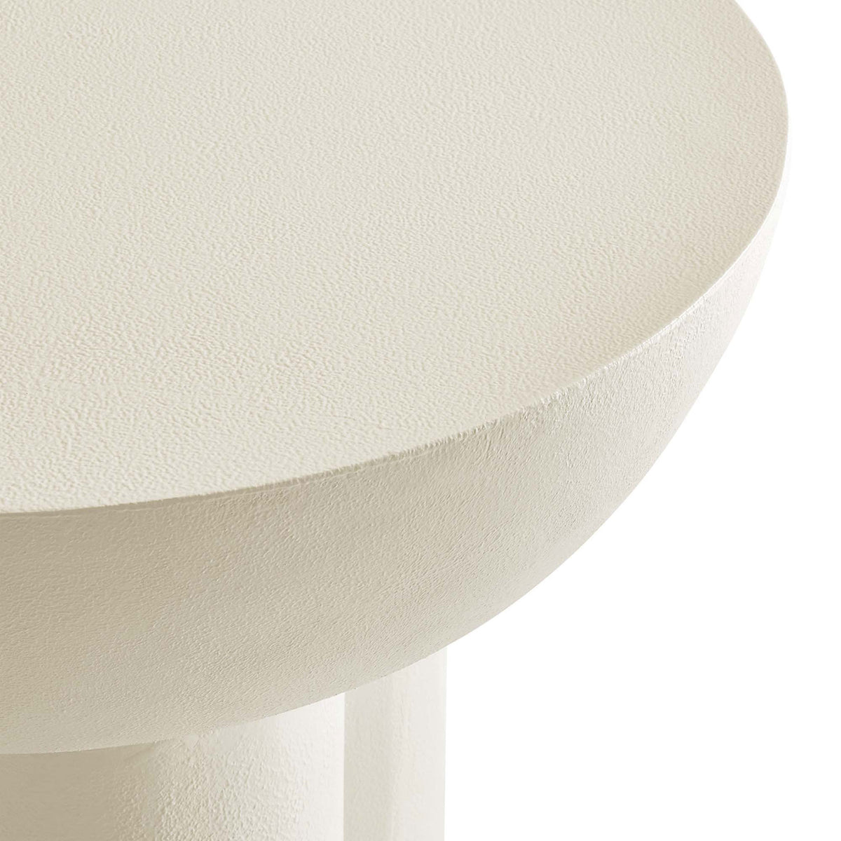 Thick round tabletop with softly curved edge and textured concrete-style finish for a refined modern look || EEI-6761-WHI || detail_studio