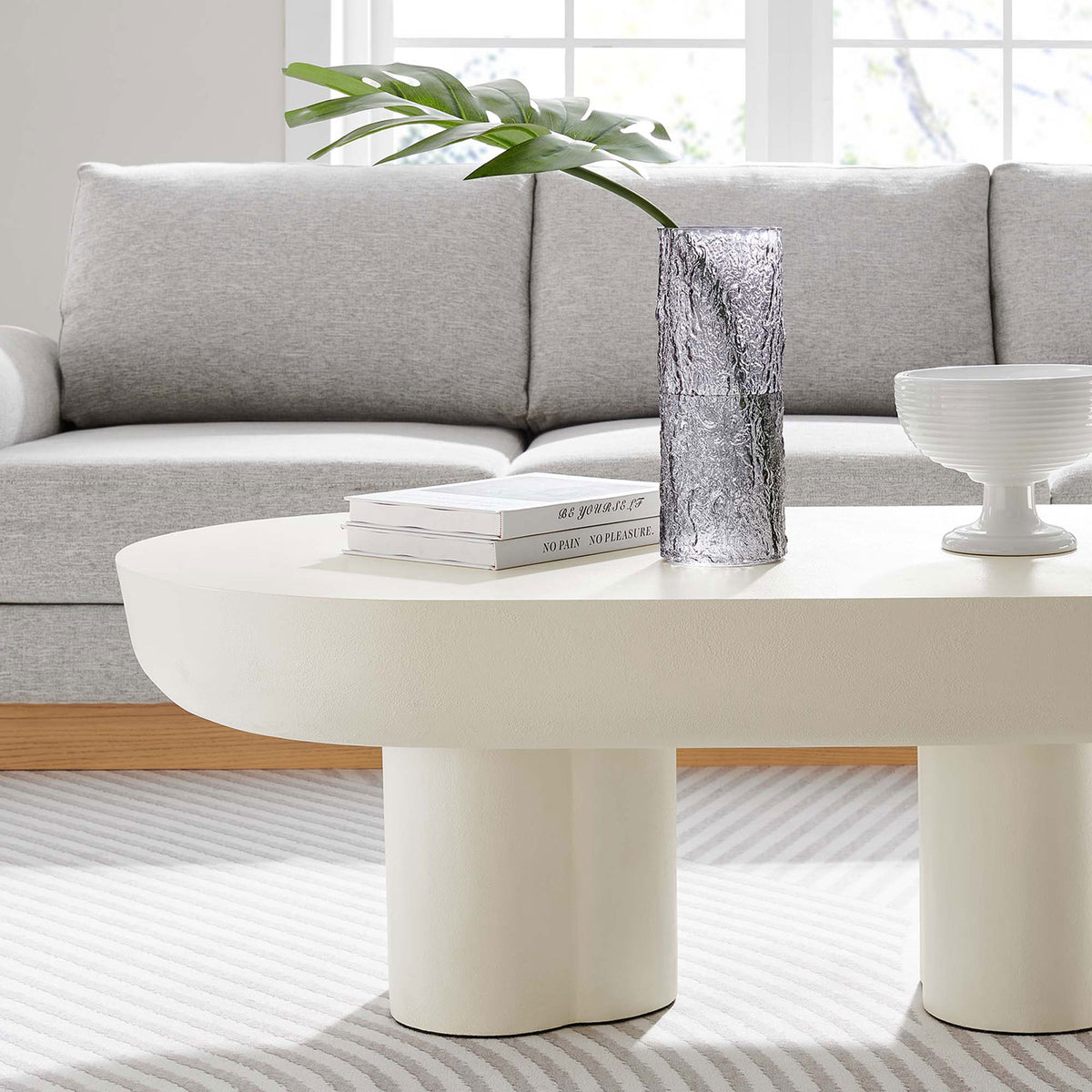Creamy white finish pairs effortlessly with neutral decor for a calm, elevated living room look || EEI-6763-WHI || detail_room
