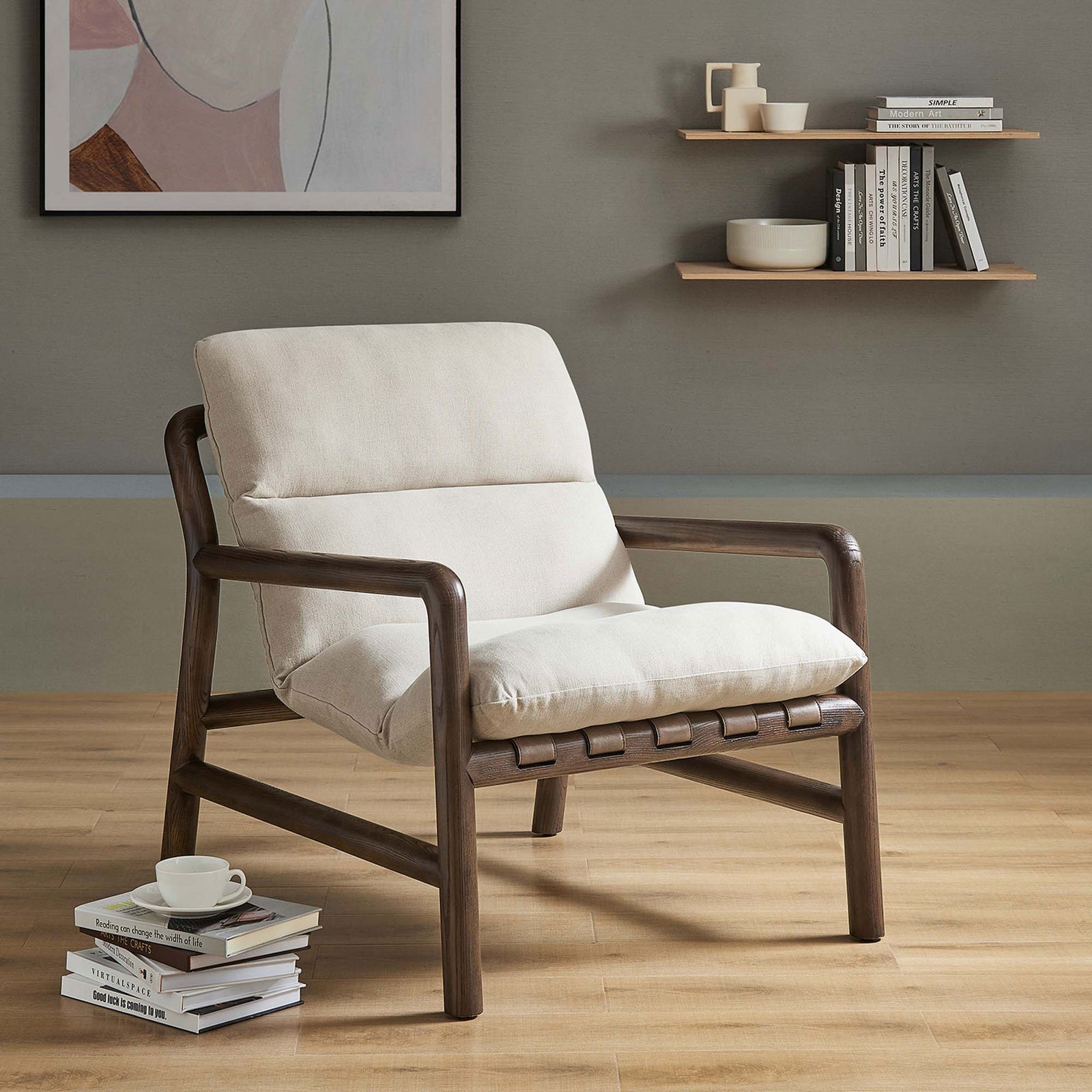 Neutral dune fabric and warm walnut wood elevate this modern lounge chair in a curated living room. || EEI-6766-DUN-WAL || front_angle_room