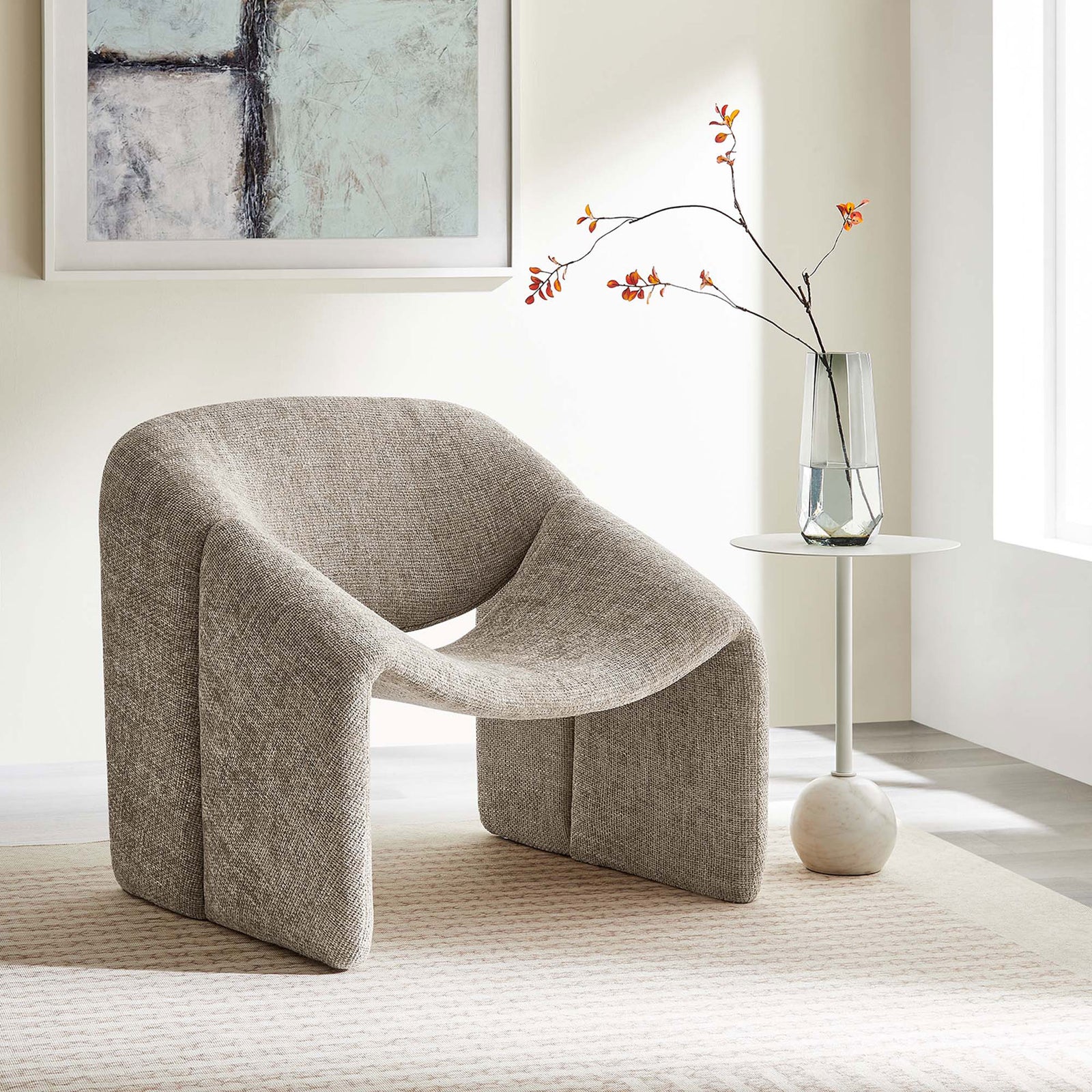 Statement chair elevates the room with sculptural curves and cozy chenille in a versatile khaki hue. || EEI-6767-KHA || front_angle_room