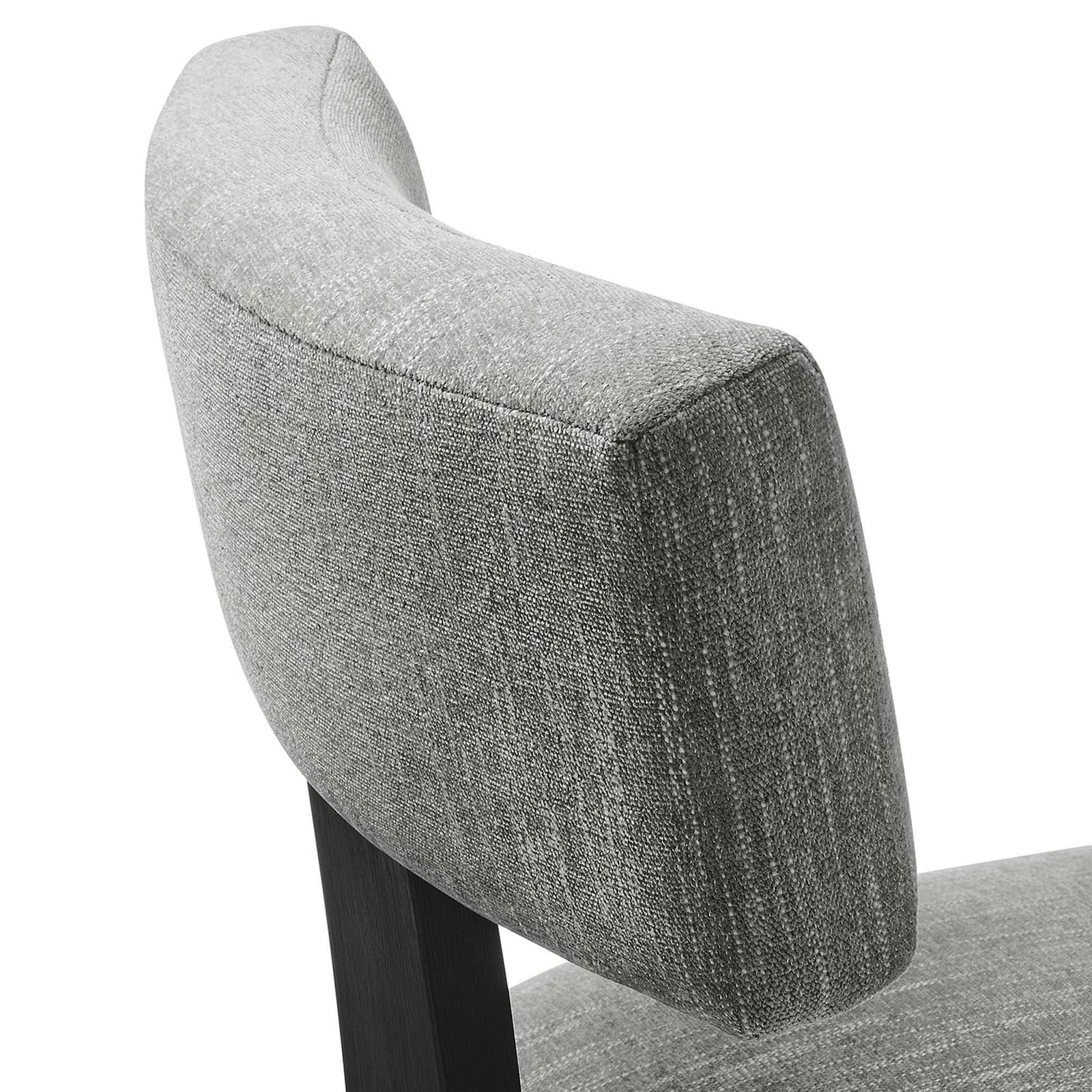 Heathered gray upholstery showcases its soft texture and tailored curves on the dining chair back || EEI-6777-HEG-BLK || detail_studio