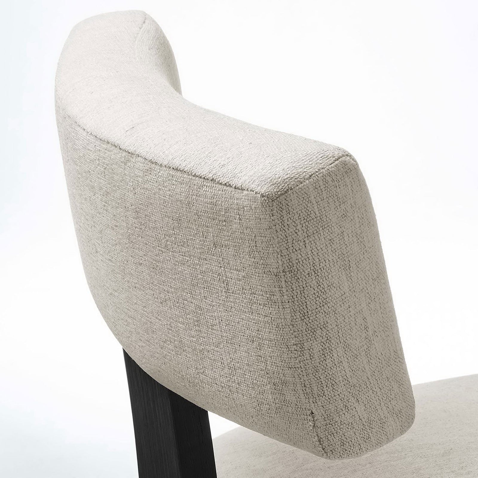 Close-up of soft textured ivory upholstery wrapping the curved backrest for tailored comfort || EEI-6777-HEI-BLK || detail_studio