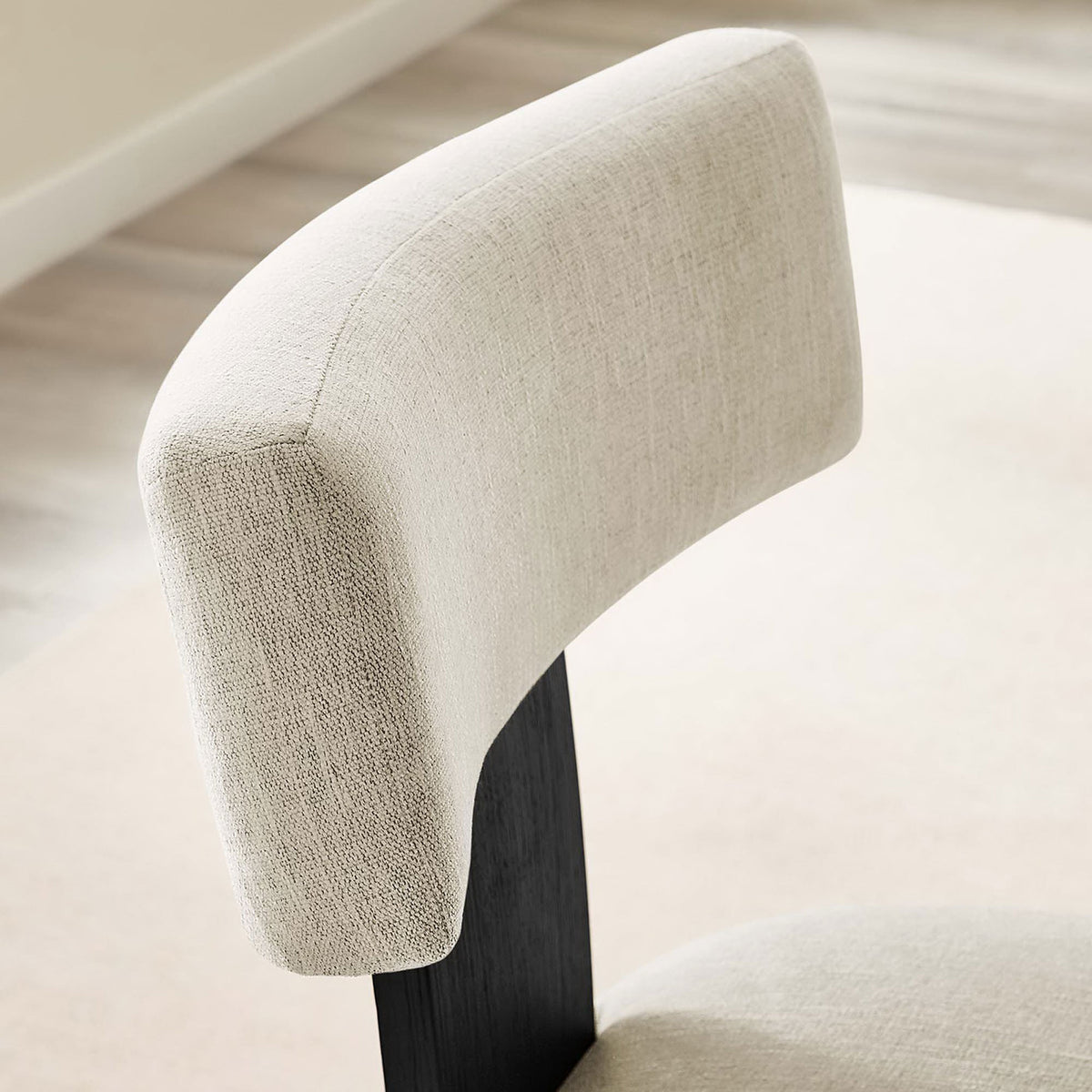 Textured ivory back cushion detail against a soft neutral dining room backdrop || EEI-6777-HEI-BLK || detail_room