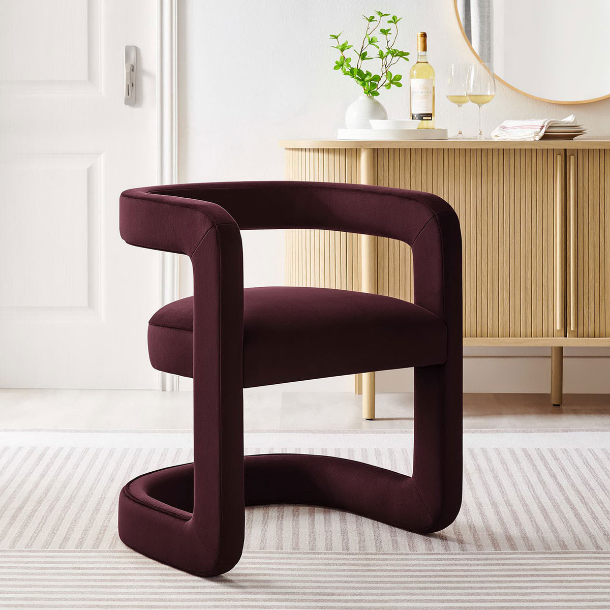 Contemporary open-back accent chair elevates the room with rich mulberry velvet and clean lines || EEI-6778-MUL || front_angle_room