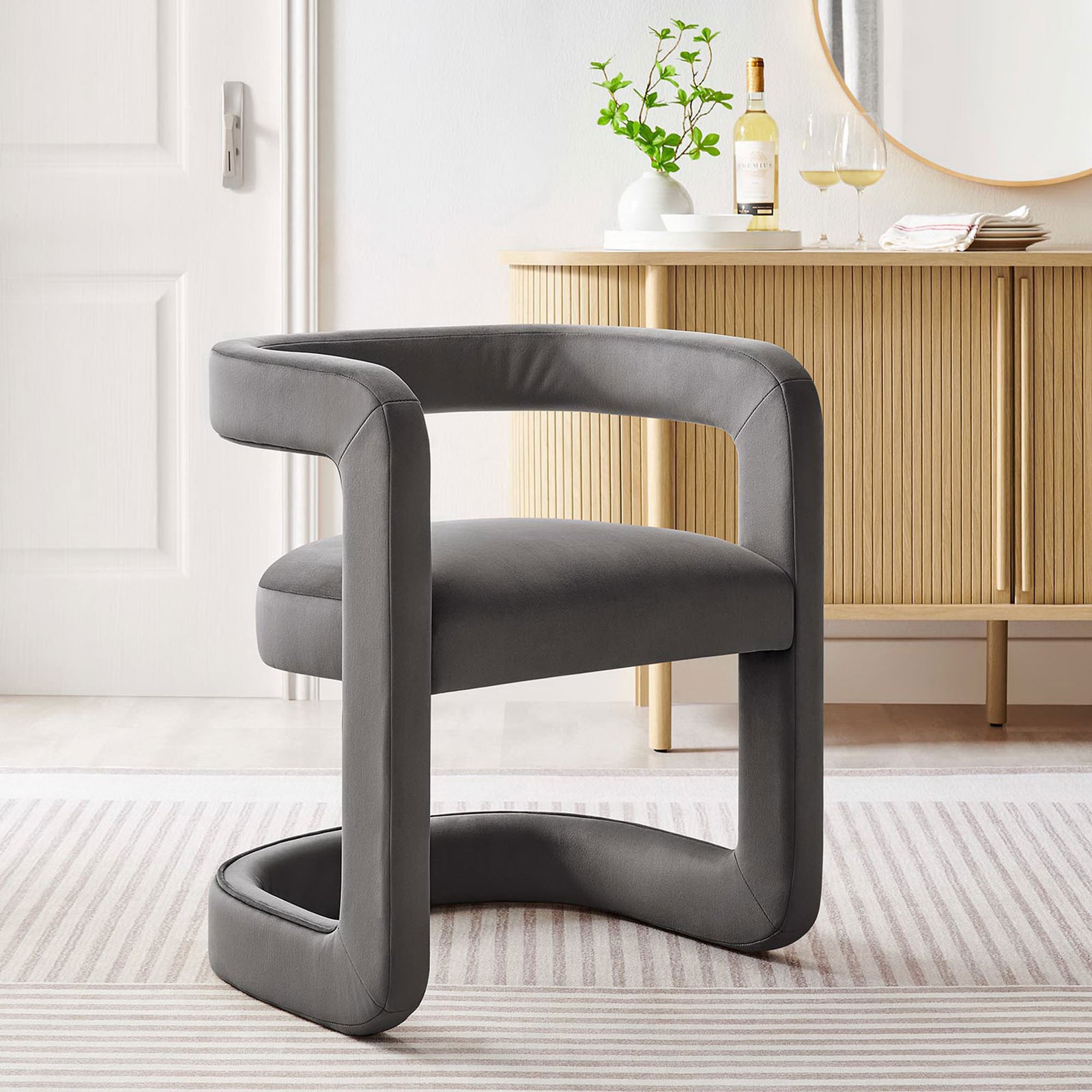 Modern gray velvet barrel chair elevates the room with its airy open-back design || EEI-6778-STG || front_angle_room