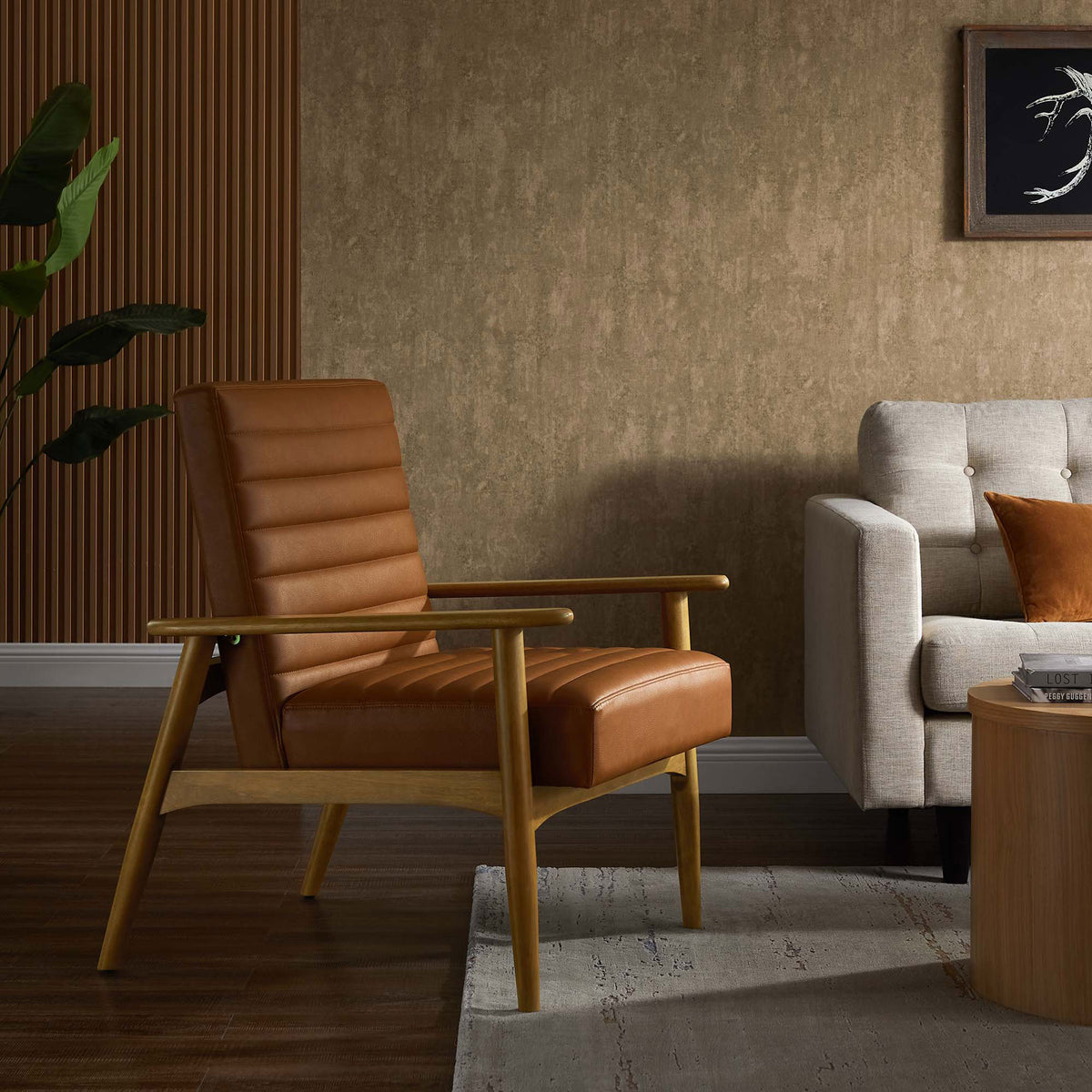Warm tan vegan leather and oak-toned wood anchor a cozy living space with inviting, mid-century lounge comfort. || EEI-6779-FRO-TAN || front_angle_room