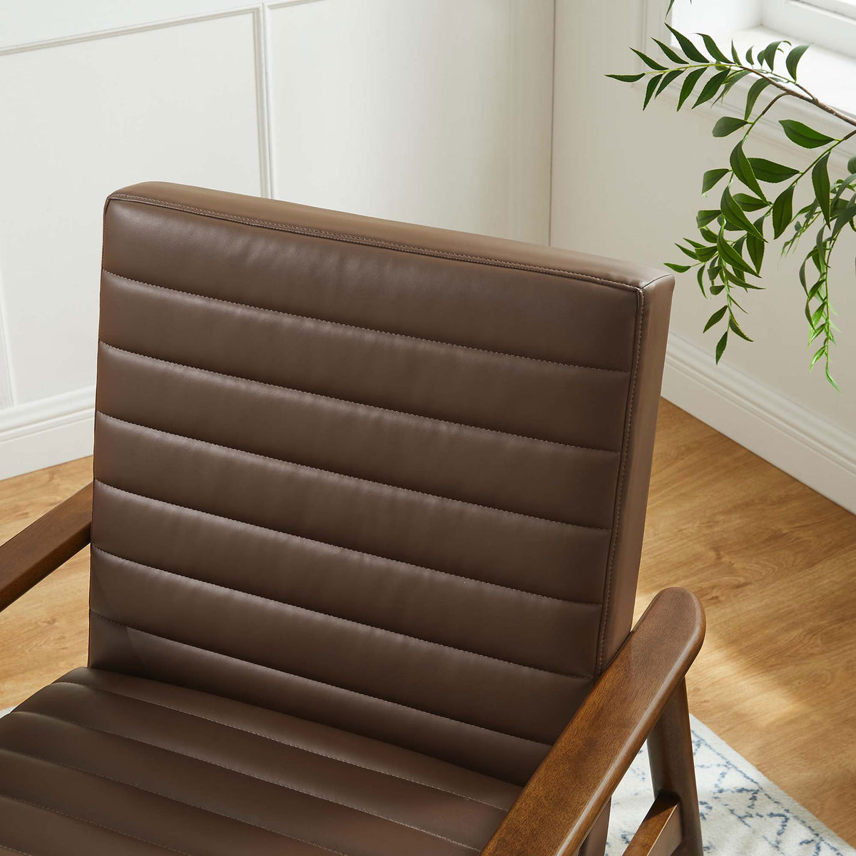 Rich walnut brown upholstery and precise channeling add texture and inviting warmth to decor. || EEI-6779-WAL-BRN || detail_room