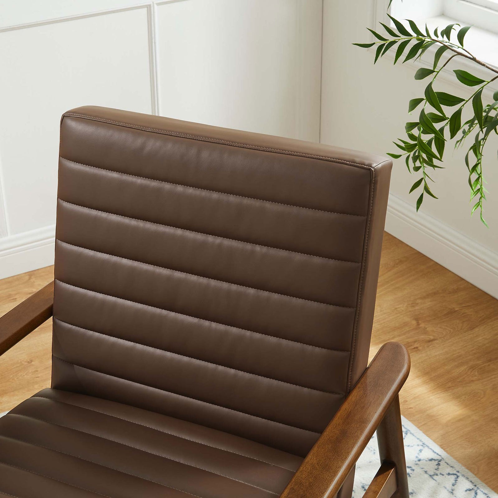 Rich walnut brown upholstery and precise channeling add texture and inviting warmth to decor. || EEI-6779-WAL-BRN || detail_room