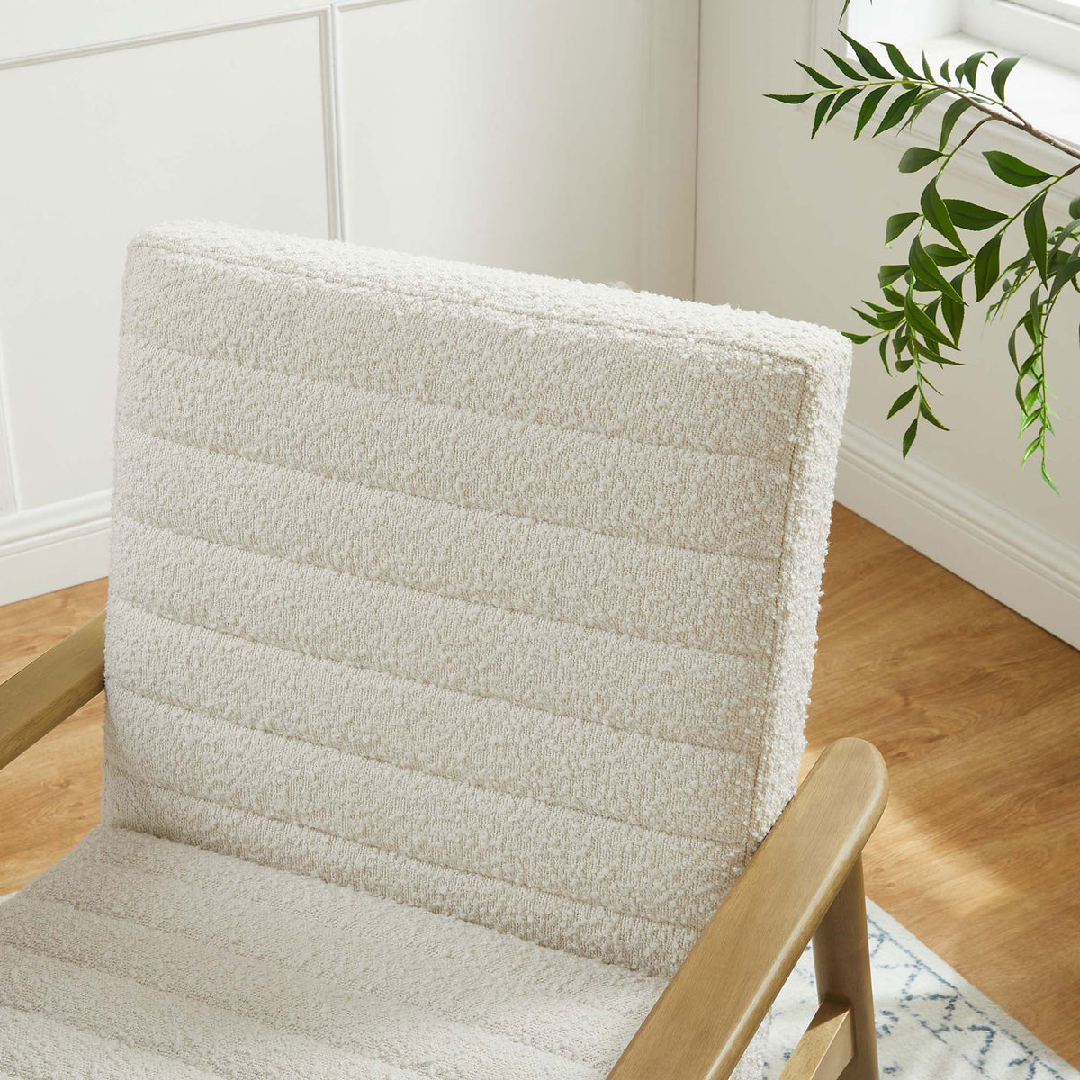 Textured boucle backrest adds cozy depth alongside natural wood accents || EEI-6780-FRO-IVO || detail_room