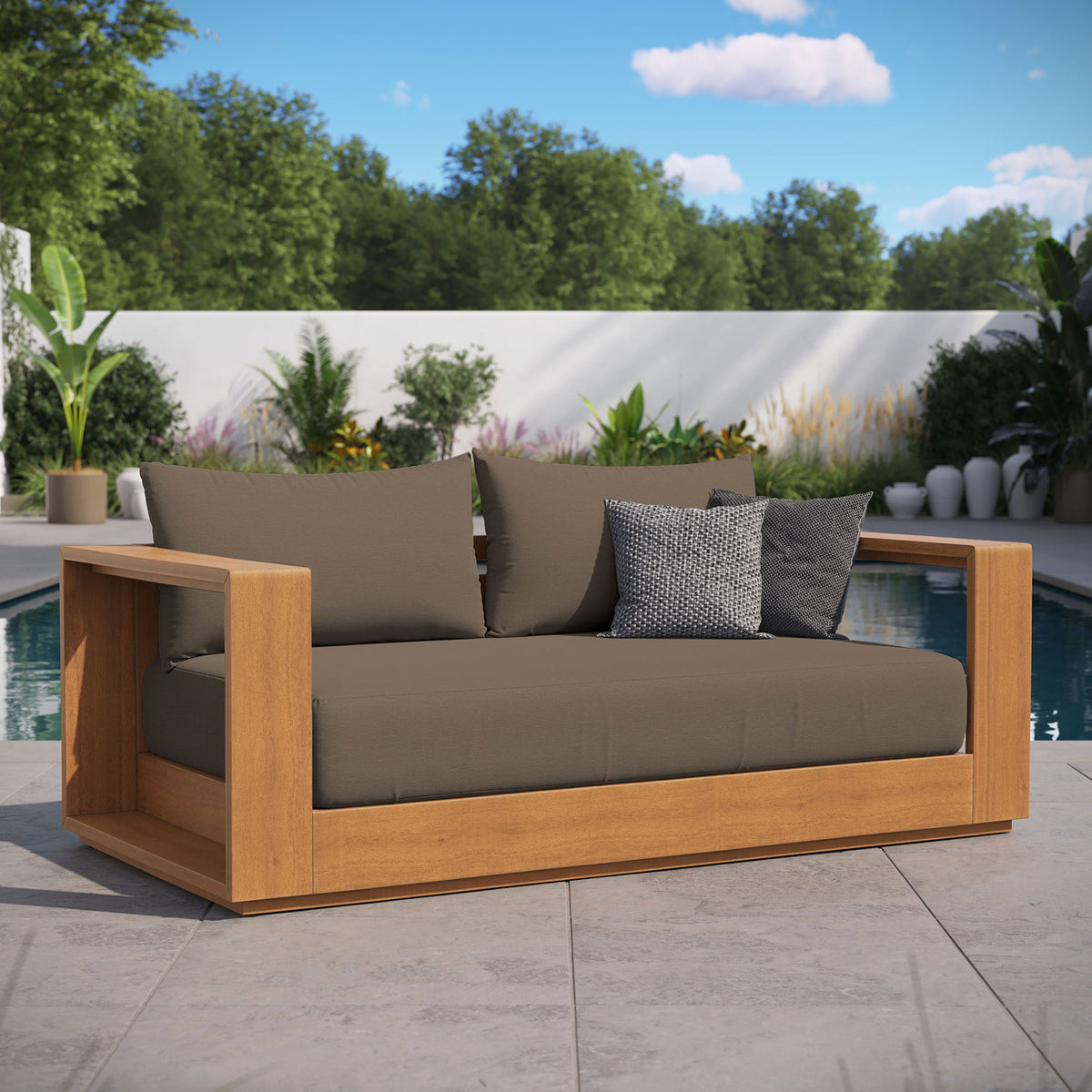 Tahoe acacia wood outdoor loveseat with cocoa cushions styled on a poolside patio with accent pillows || EEI-6783-NAT-COA || front_angle_room