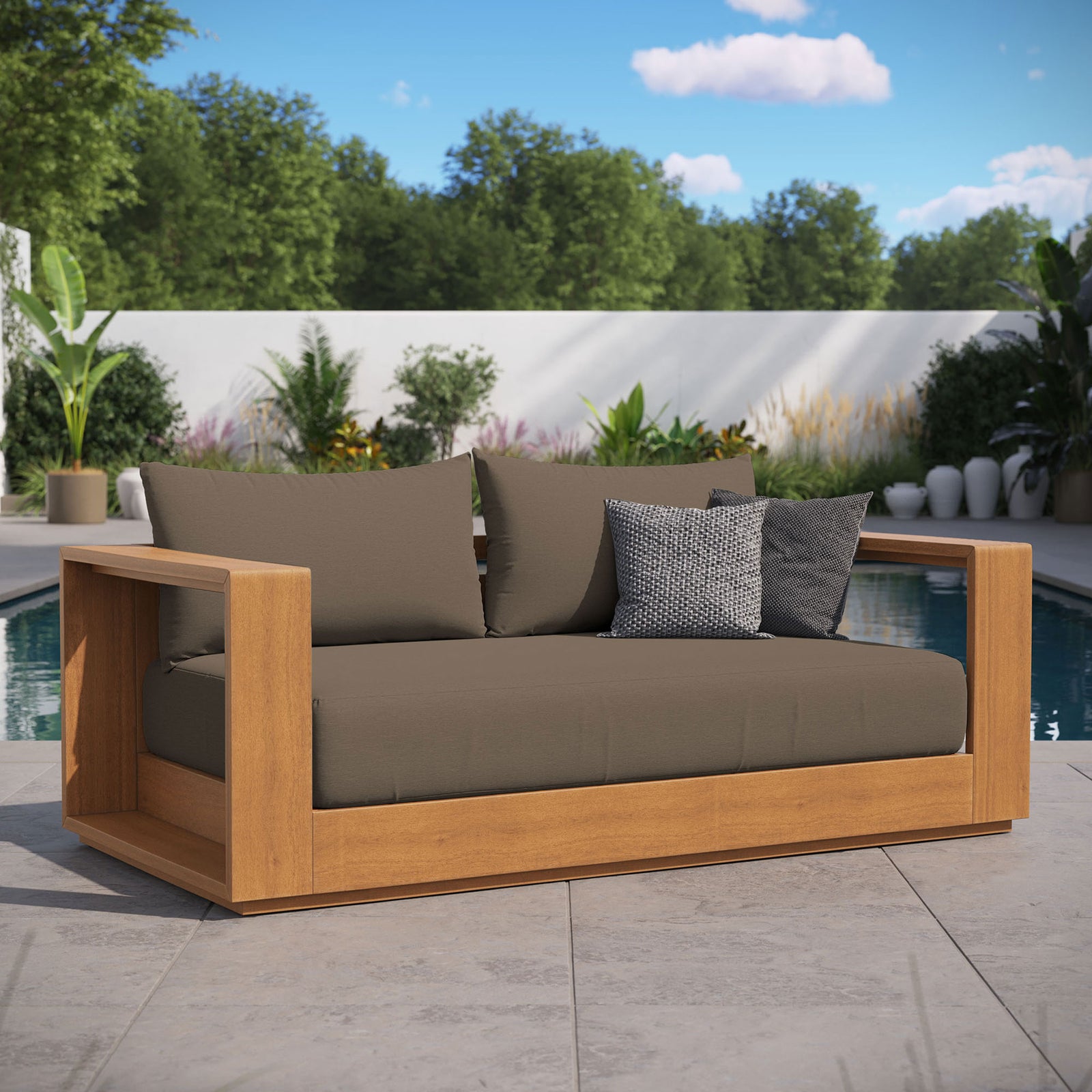 Tahoe acacia wood outdoor loveseat with cocoa cushions styled on a poolside patio with accent pillows || EEI-6783-NAT-COA || front_angle_room
