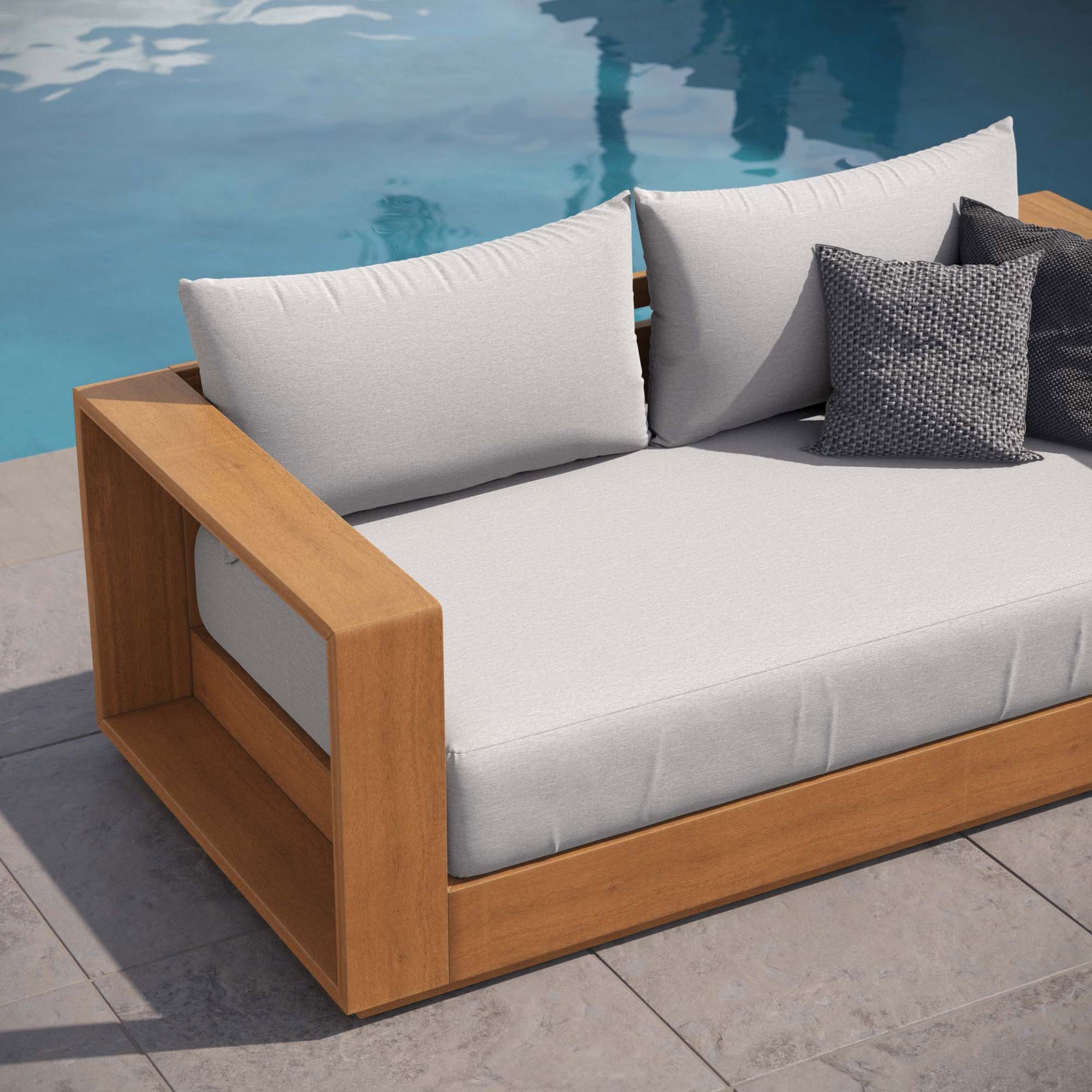Tahoe acacia loveseat by the pool styled with light gray cushions for relaxed resort-inspired lounging || EEI-6783-NAT-LGR || detail_room