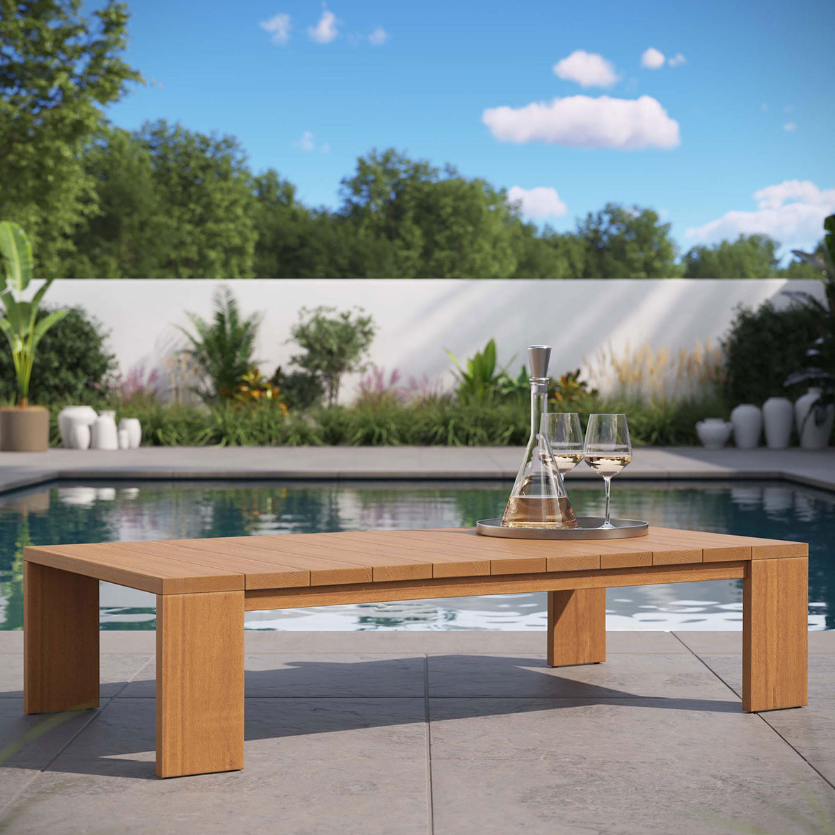 Natural acacia outdoor coffee table styled by the pool for a relaxed resort-inspired patio || EEI-6786-NAT || front_angle_room
