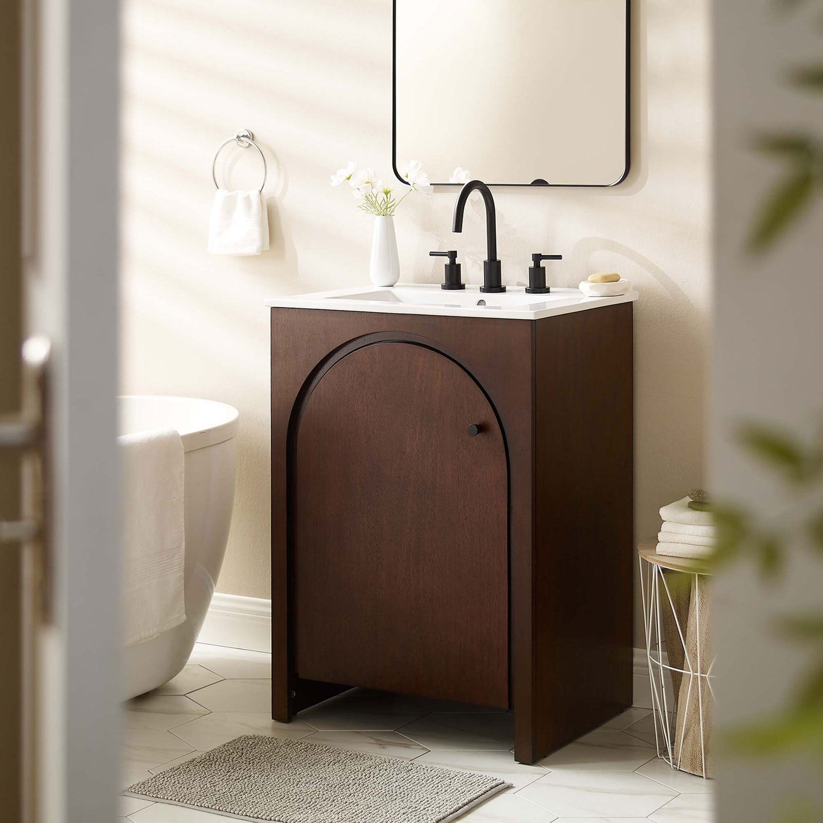 Walnut vanity elevates the bath with arched door and bright white ceramic sink || EEI-6788-WAL-WHI || front_room