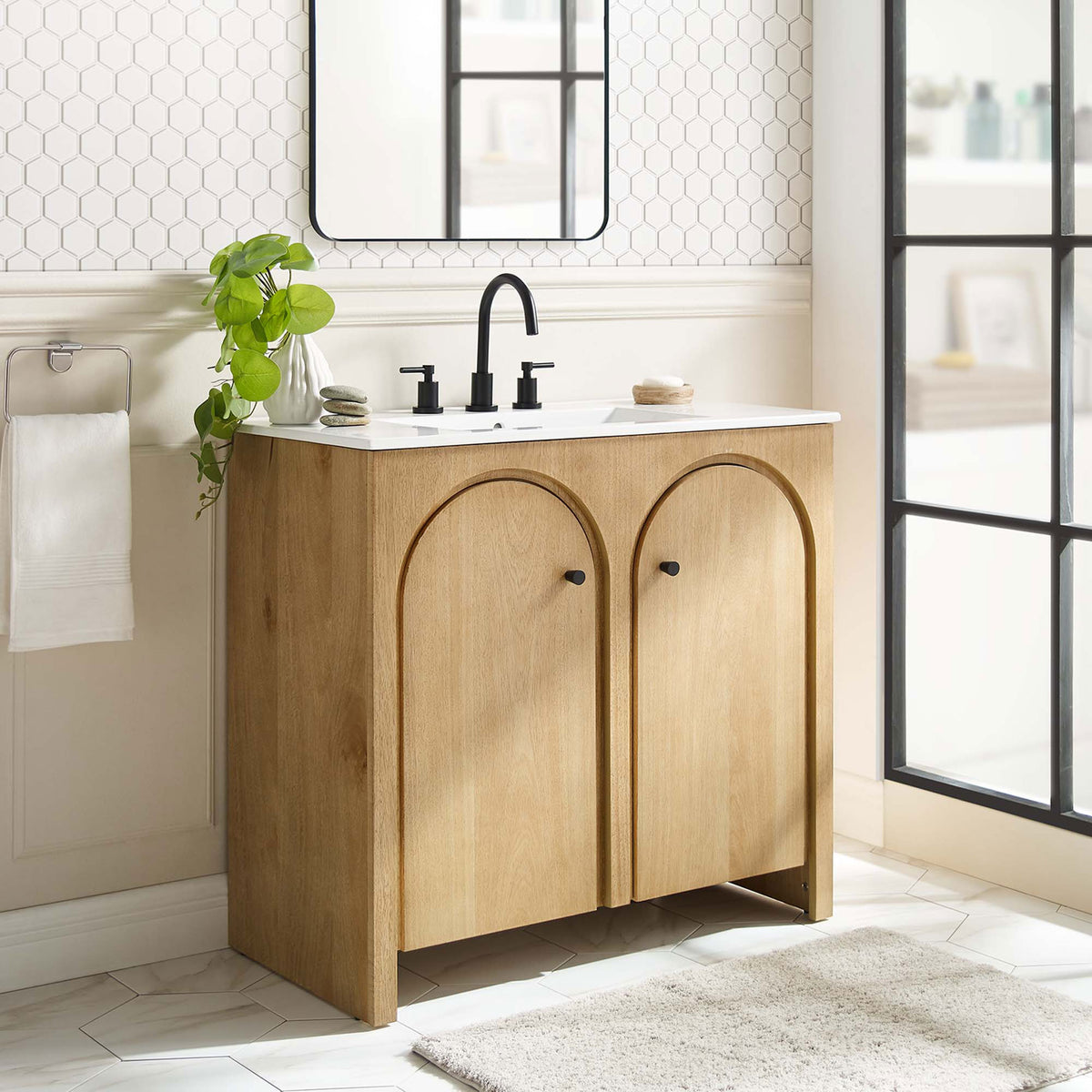 Organic oak tone and arched doors elevate everyday routines with a calm, contemporary presence. || EEI-6790-OAK-WHI || front_angle_room